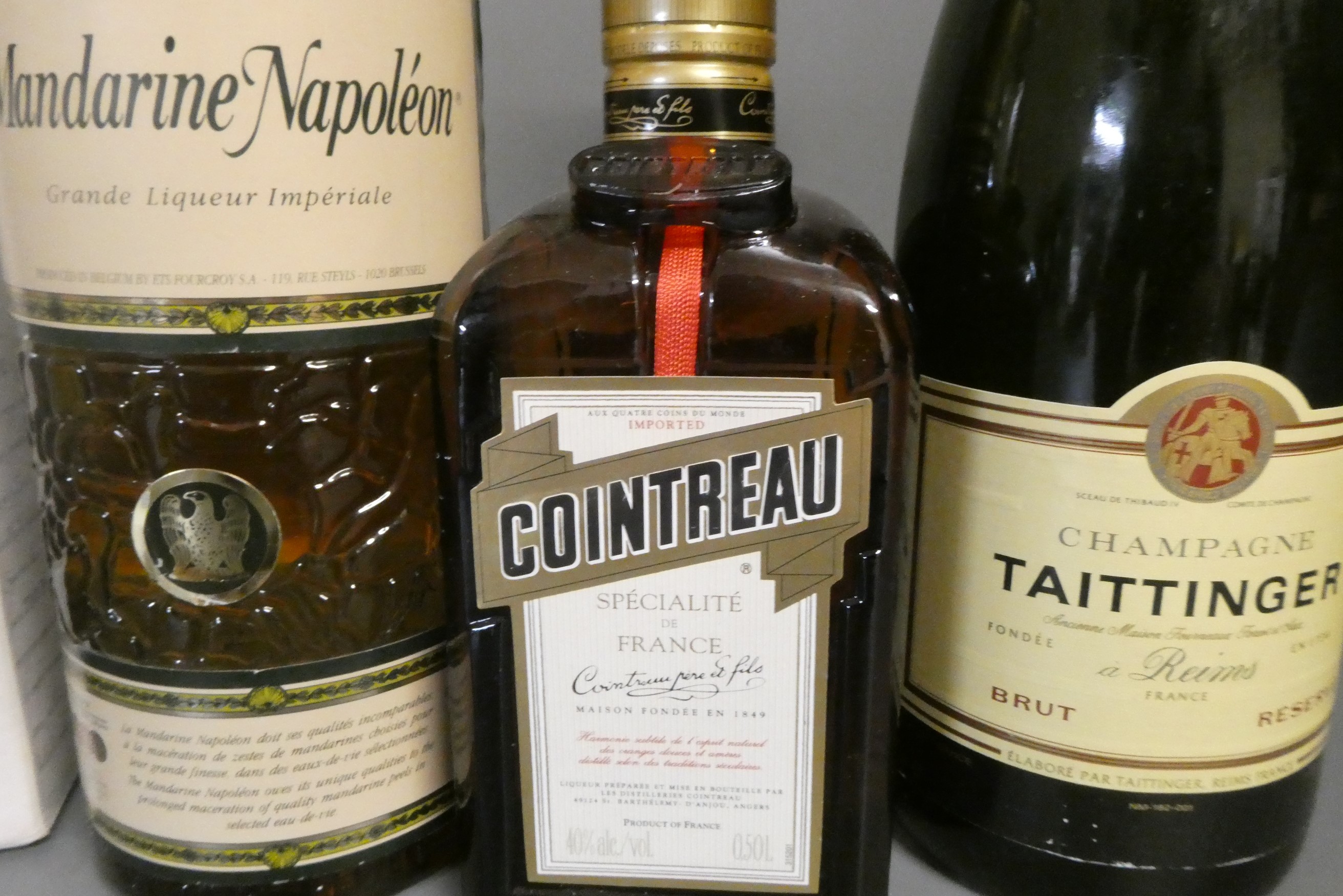 Nine bottles of champagne and mixed alcohol Image