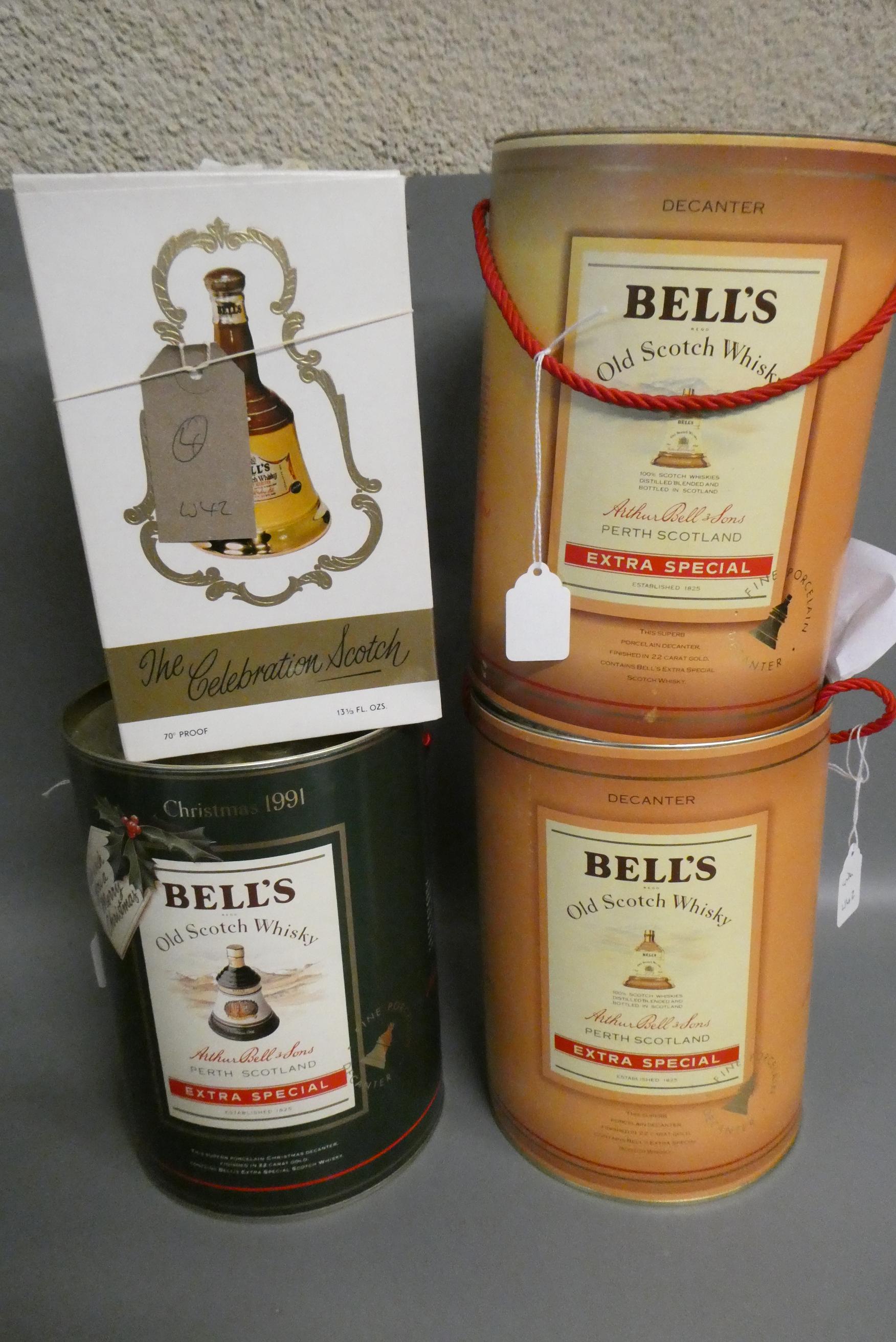 Four boxed Bell's whisky decanters, comprising a 75cl and a 37.5cl Extra Special, a 70cl Christmas Image
