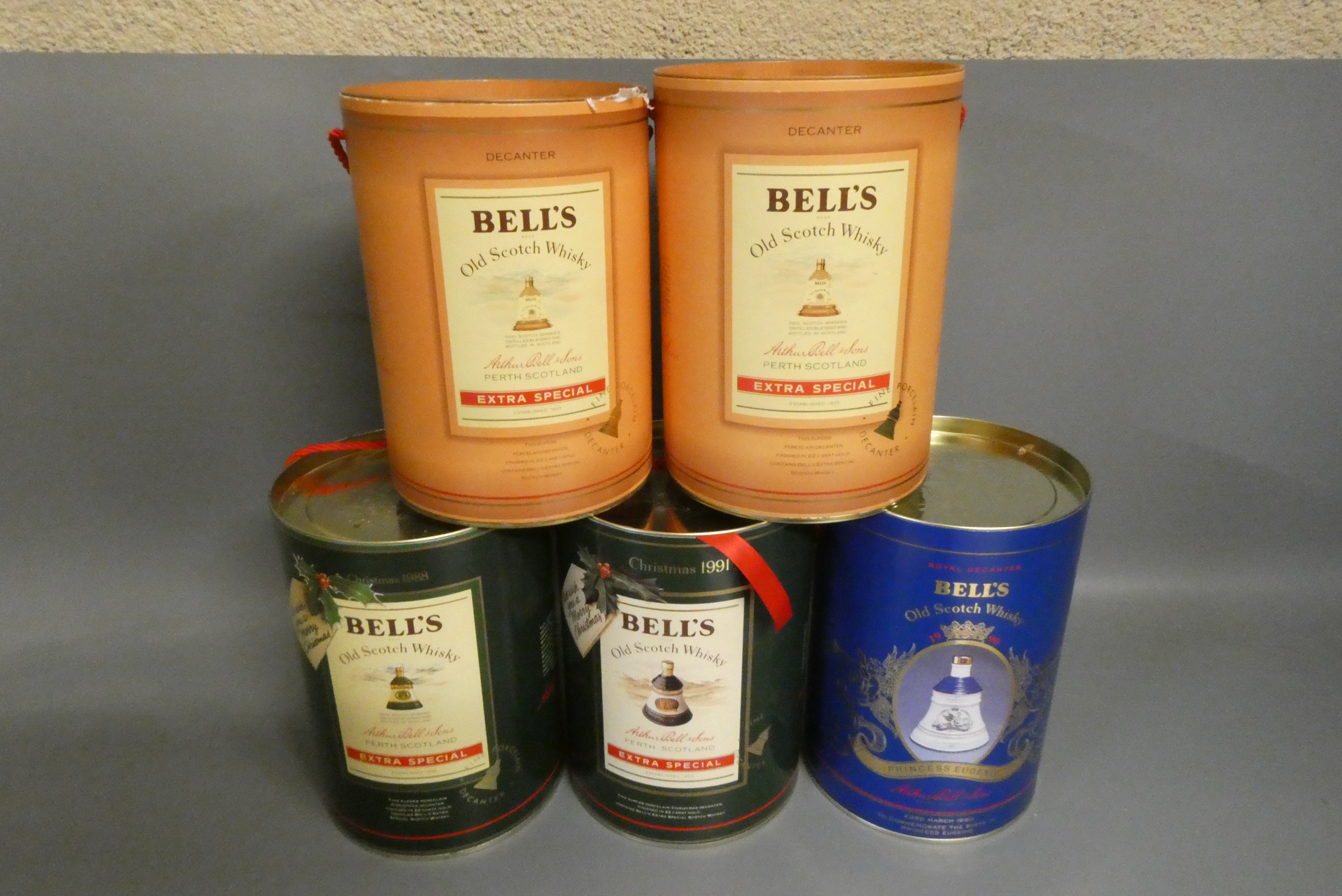 Five boxed Bell's whisky decanters, comprising a 75cl and 37.5cl Extra Special, a 70cl Christmas Image
