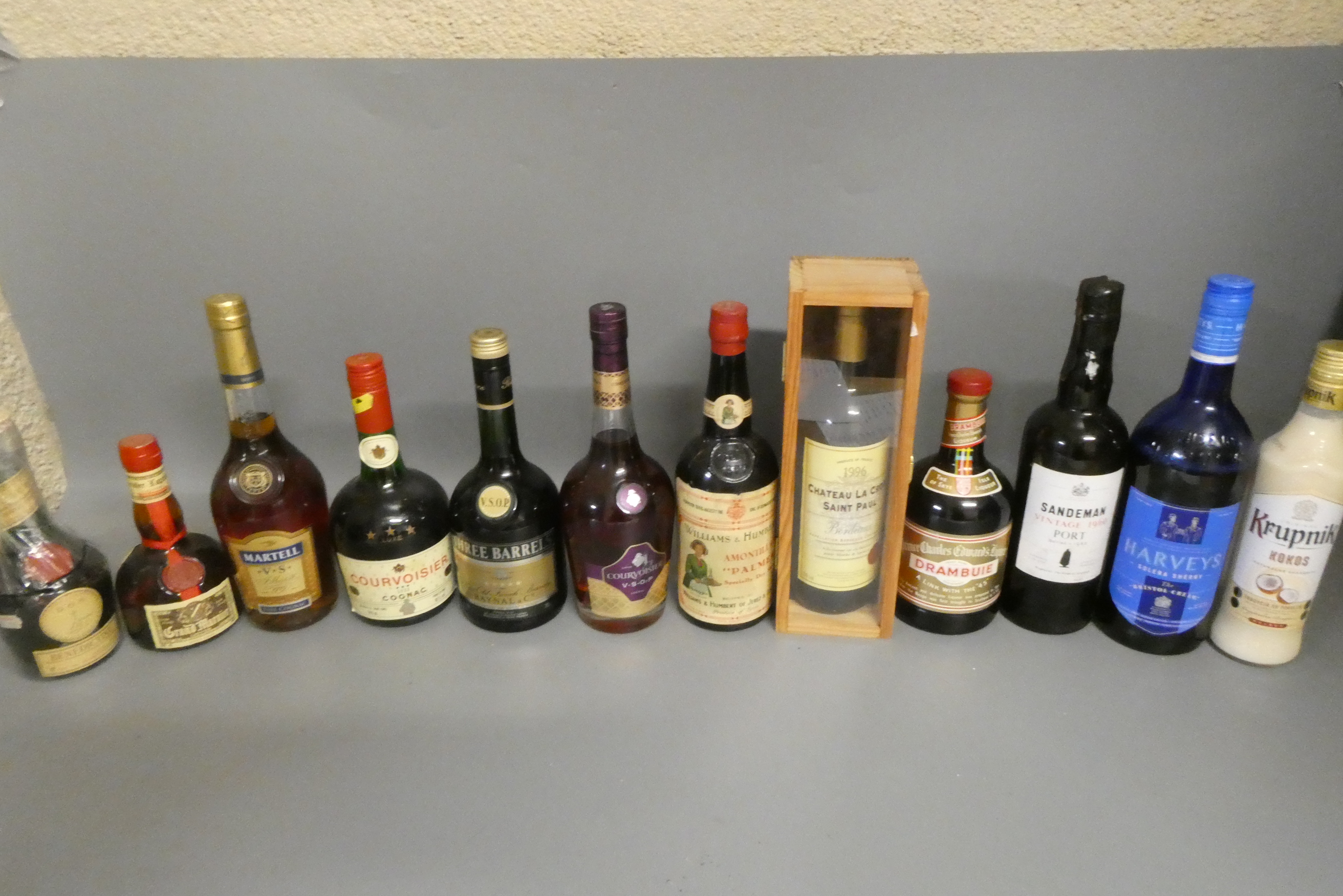 Twelve bottles of mixed alcohol and cognac Image