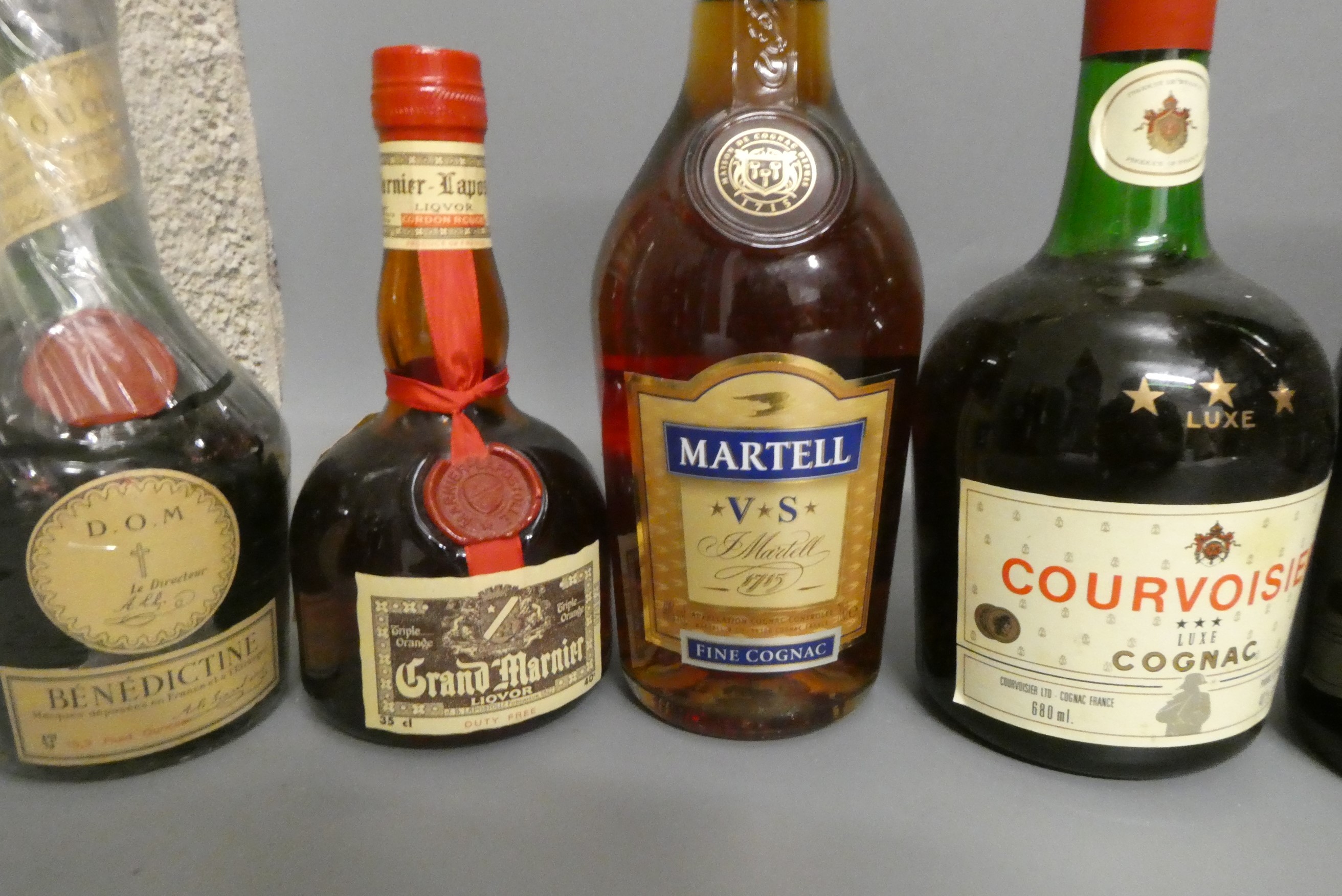Twelve bottles of mixed alcohol and cognac Image