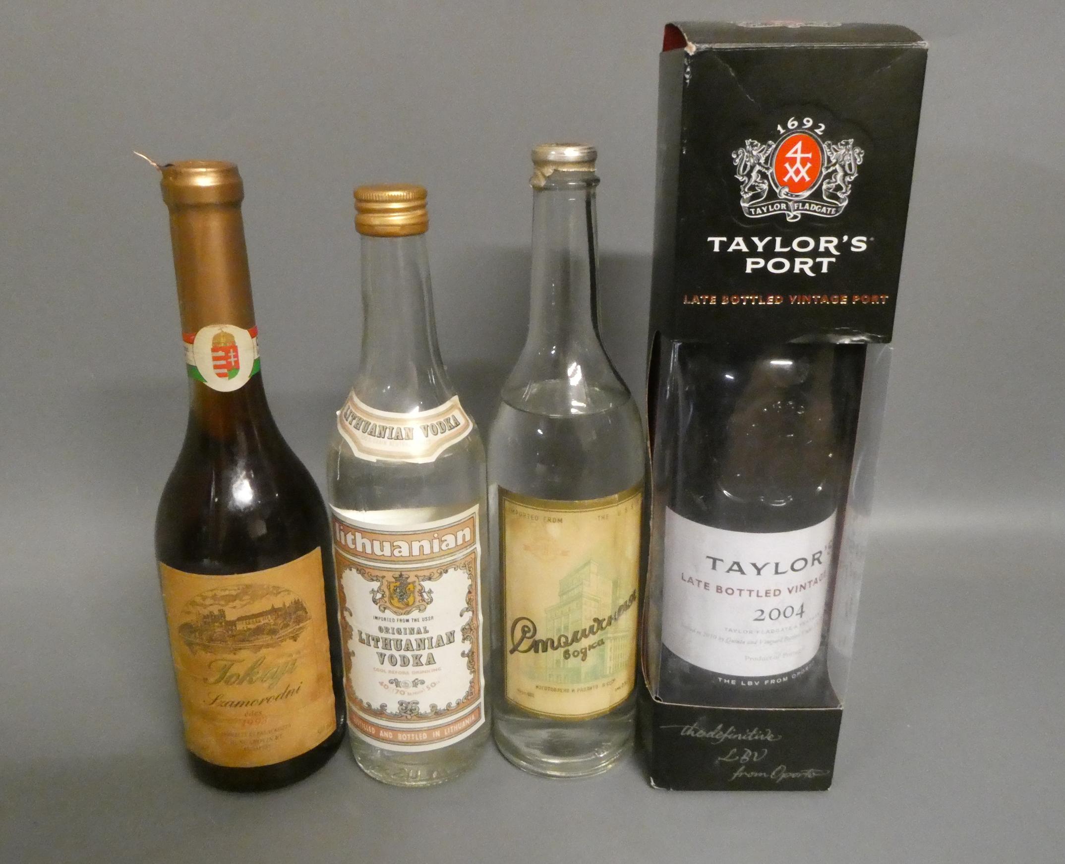 Four bottles of mixed alcohol, comprising a boxed Taylor's 2004 LBV port, a bottle of USSR vodka, a Image