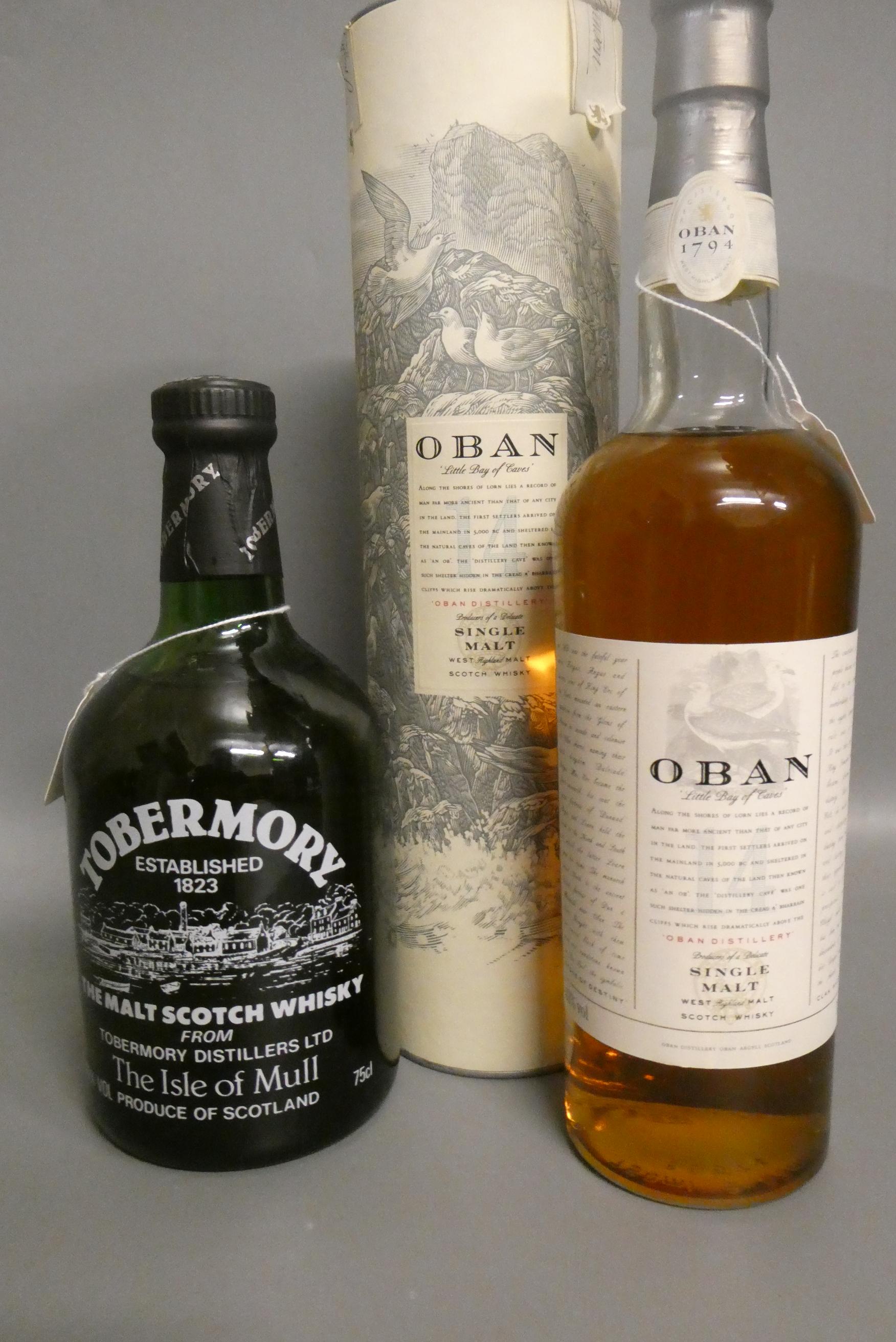 One bottle of Oban 14yr old West Highland single malt whisky, with tube, together with a Tobermory Image