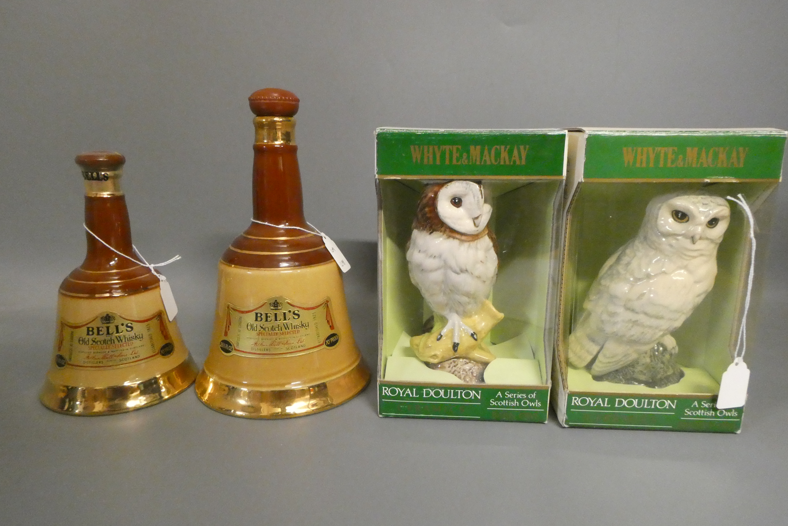 Two Whyte & Mackay Royal Doulton owl whisky decanters, boxed, together with a 26 3/4 fl. ozs. and a Image