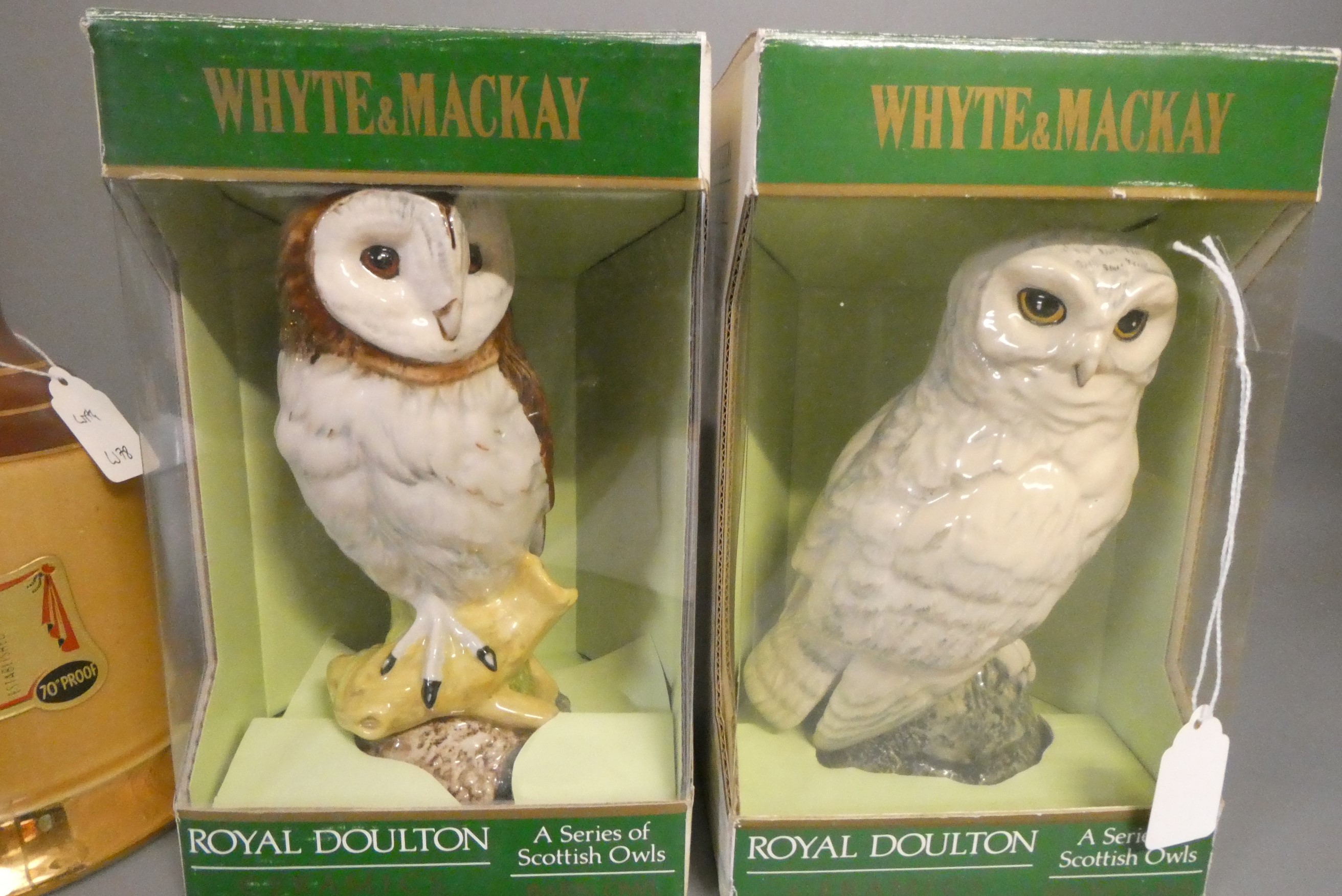 Two Whyte & Mackay Royal Doulton owl whisky decanters, boxed, together with a 26 3/4 fl. ozs. and a Image