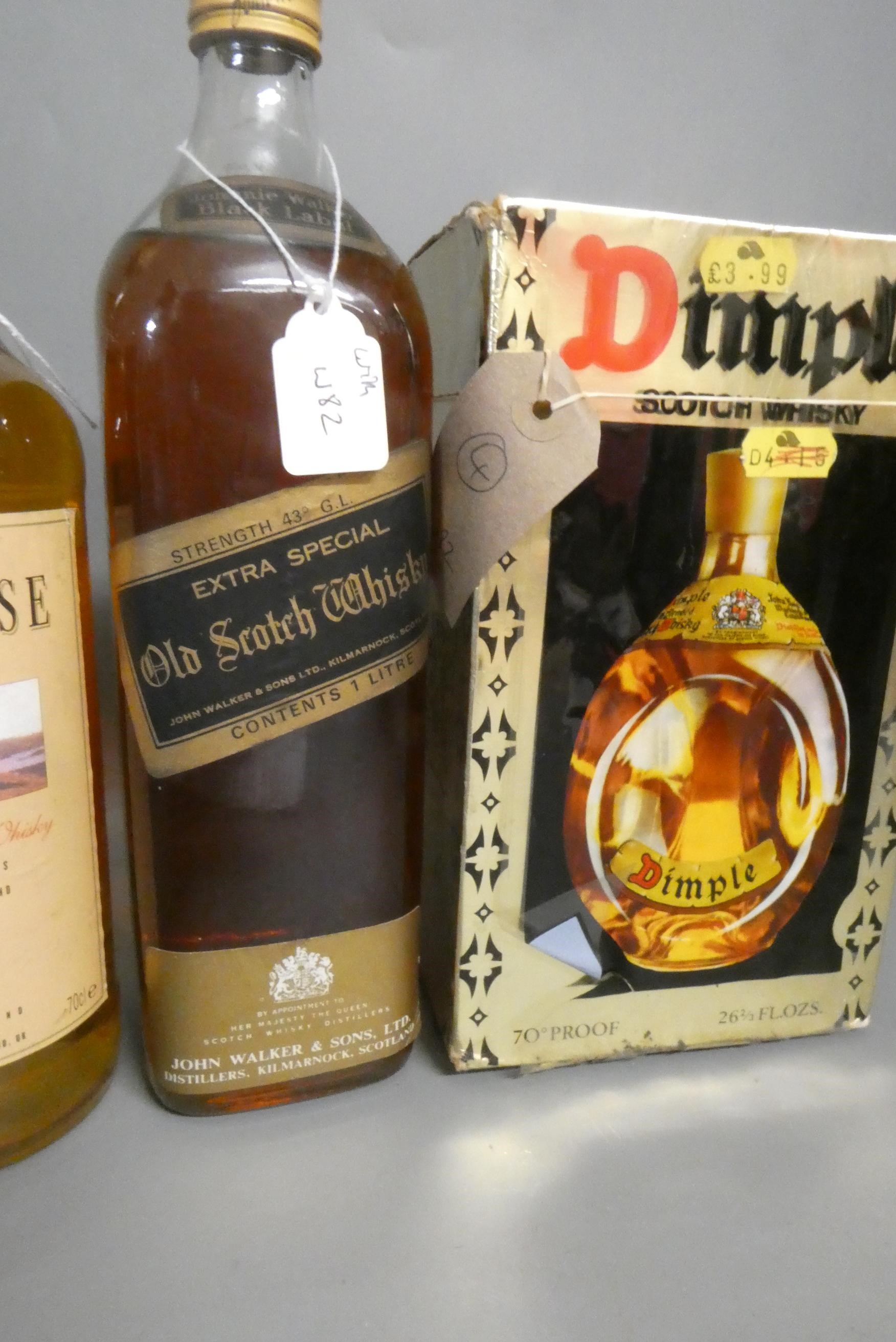 Four bottles of whisky, comprising 1litre Johnnie Walker Black Label, a 500ml Johnnie Walker Red Image