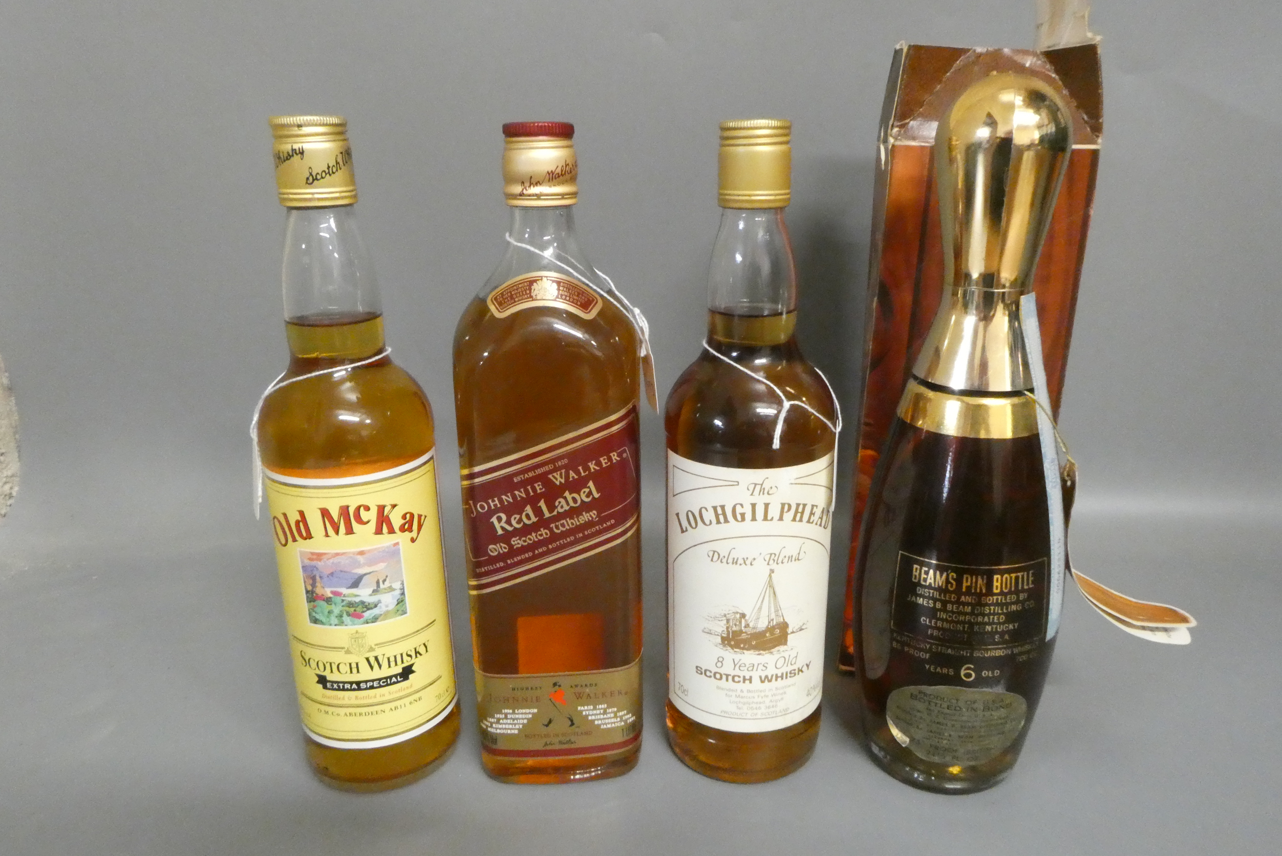 Four bottles of whisky Image