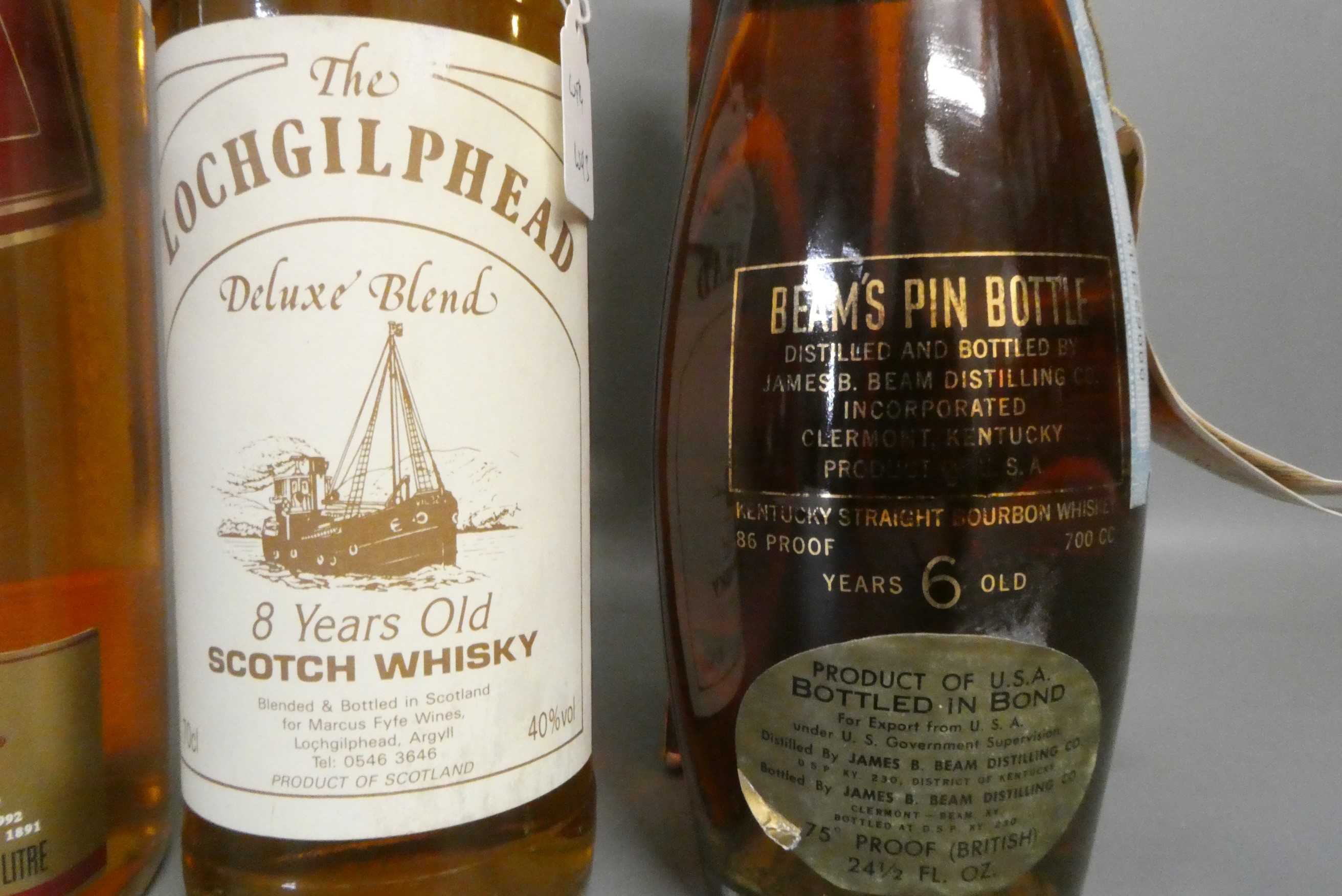 Four bottles of whisky Image