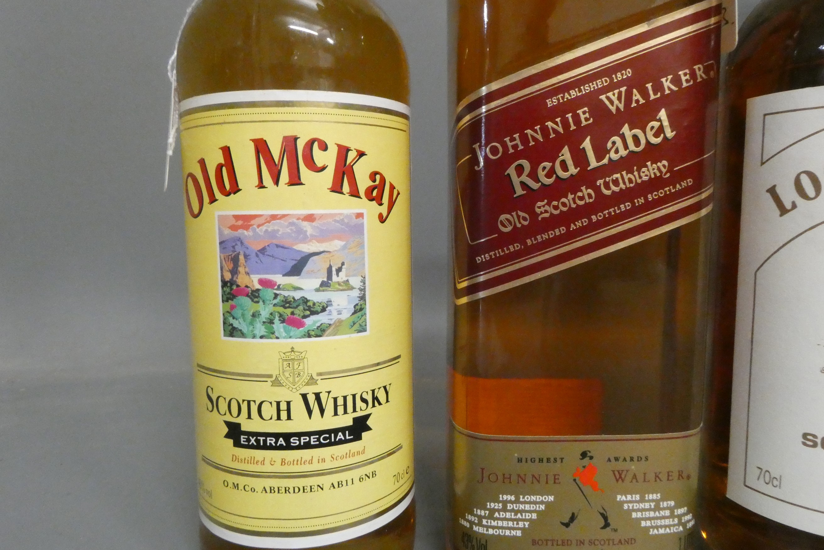 Four bottles of whisky Image