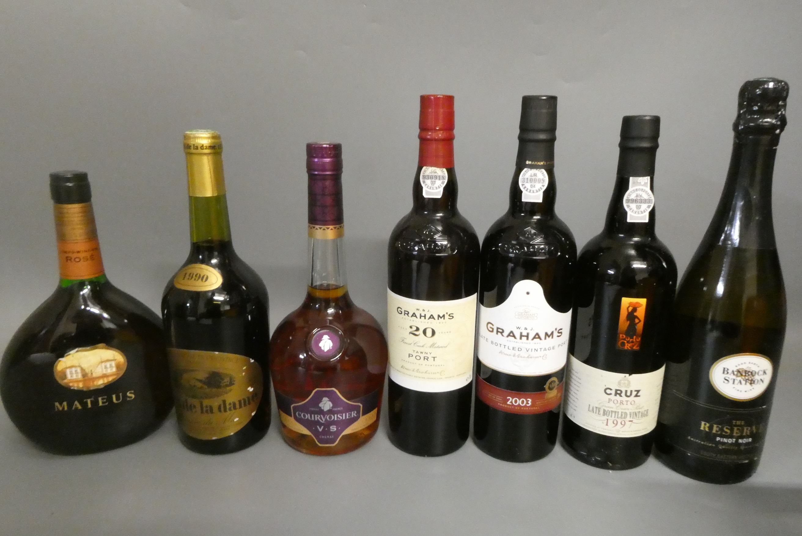 Seven bottles of mixed wine Image