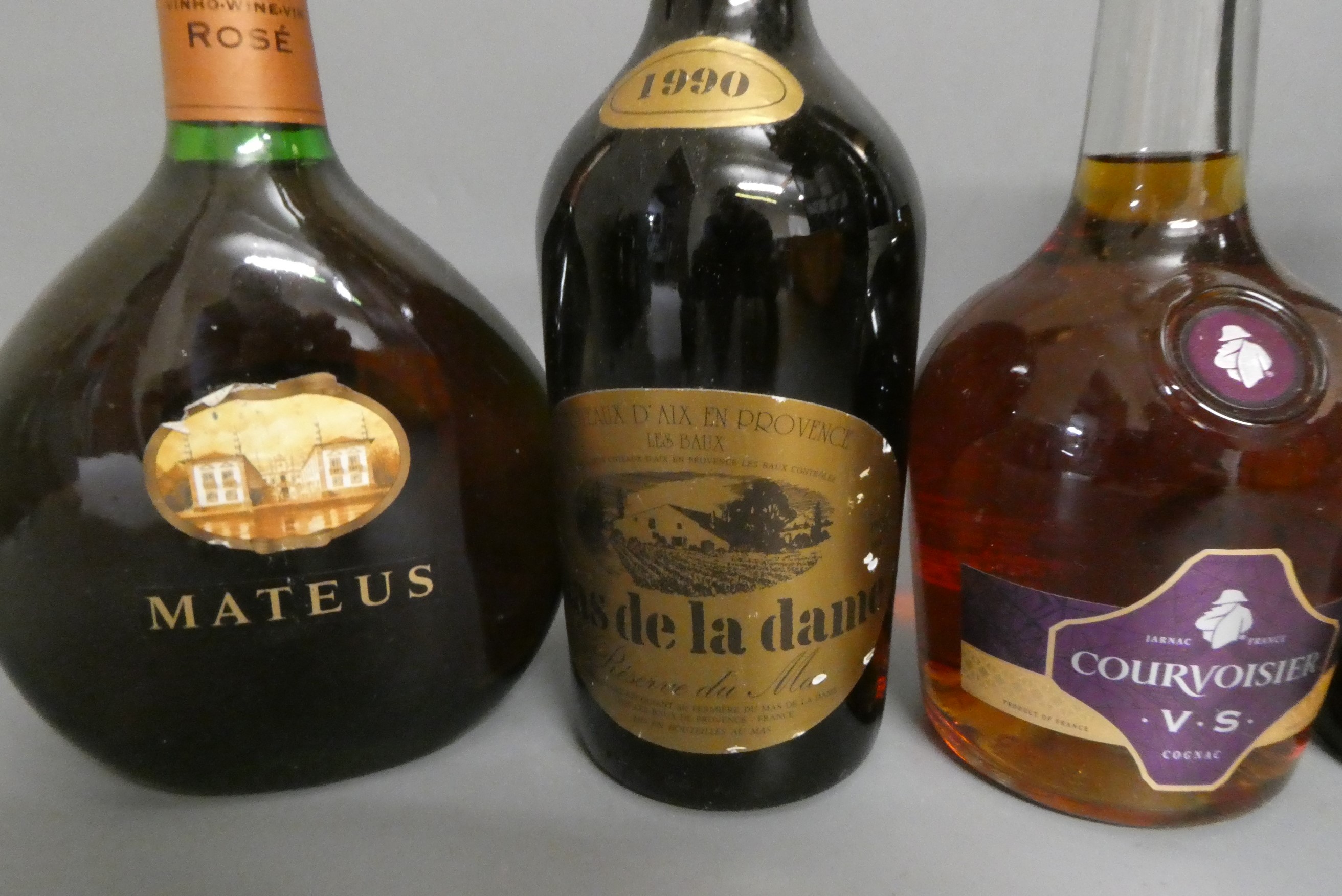 Seven bottles of mixed wine Image