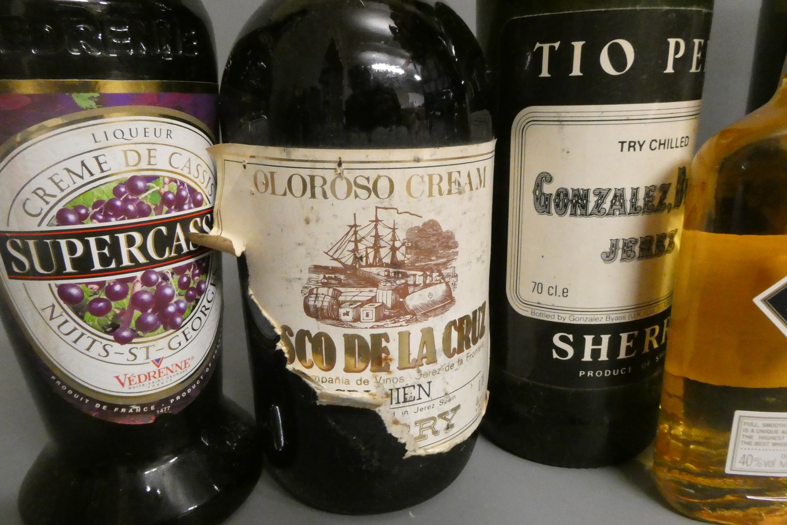 Ten and four half bottles of mixed alcohol Image