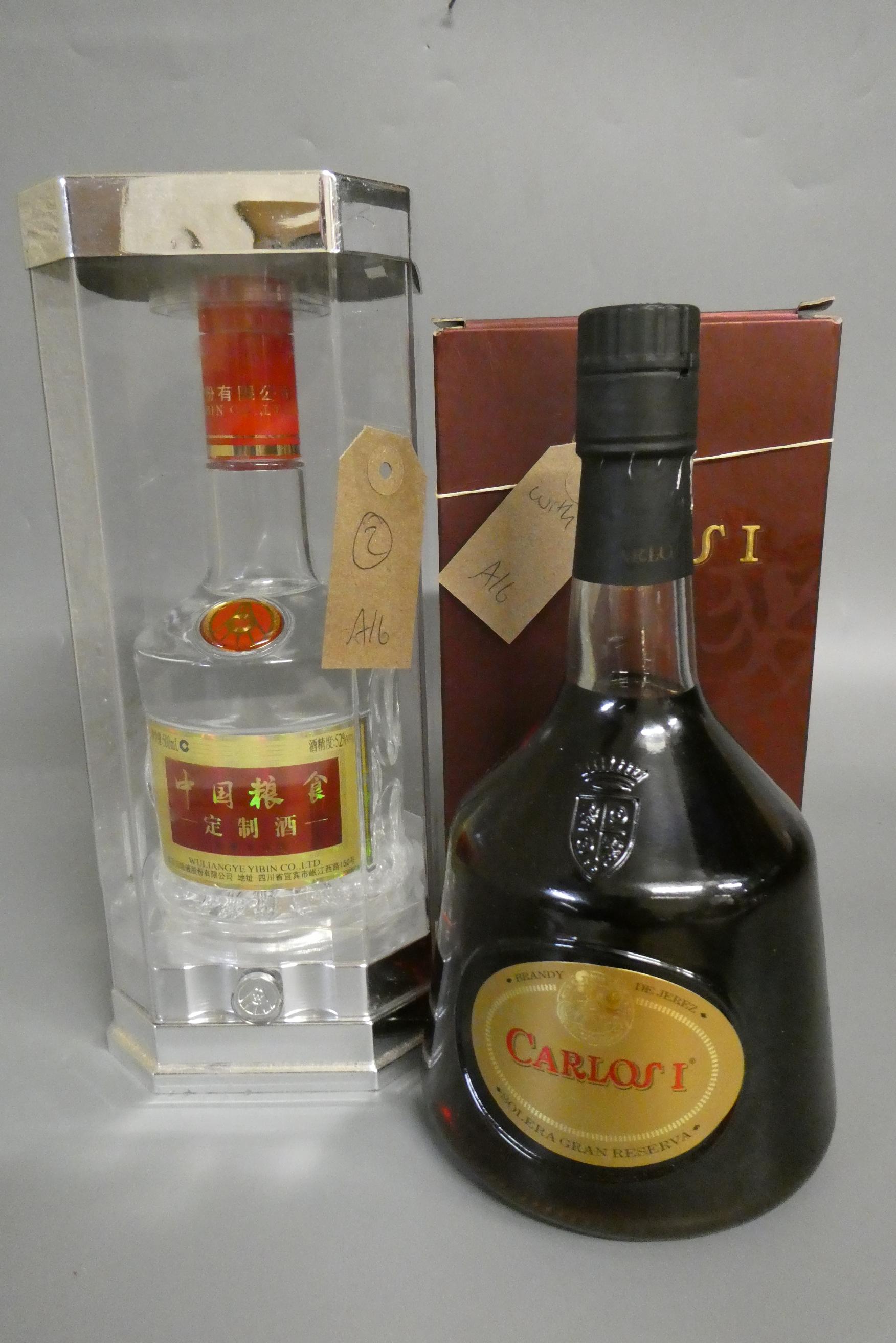 One bottle Wuliangye Yibin Co. liqueur, 52%, 500ml, in presentation box, together with 1litre Carlos Image