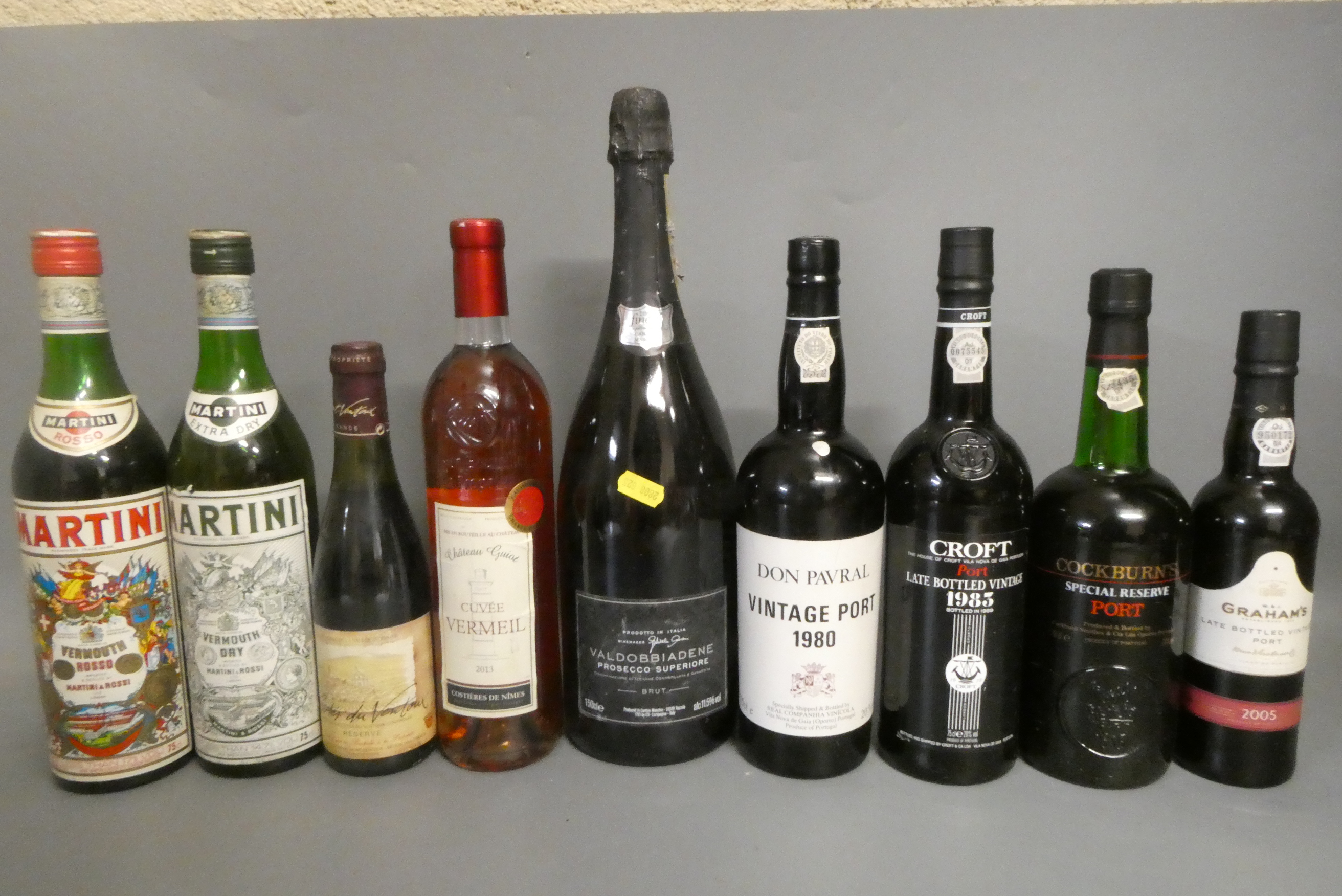 Nine bottles of port and other alcohol Image