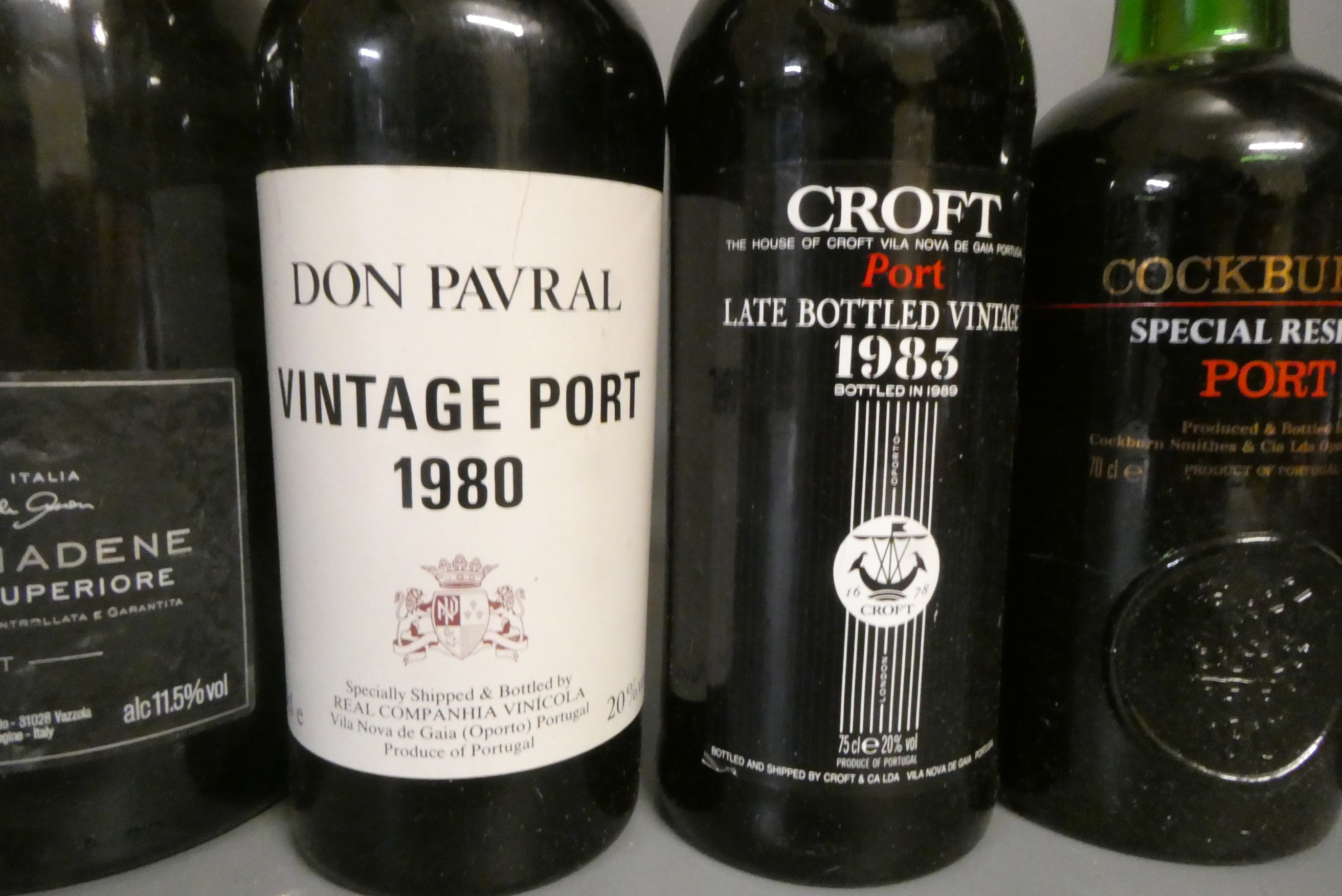 Nine bottles of port and other alcohol Image