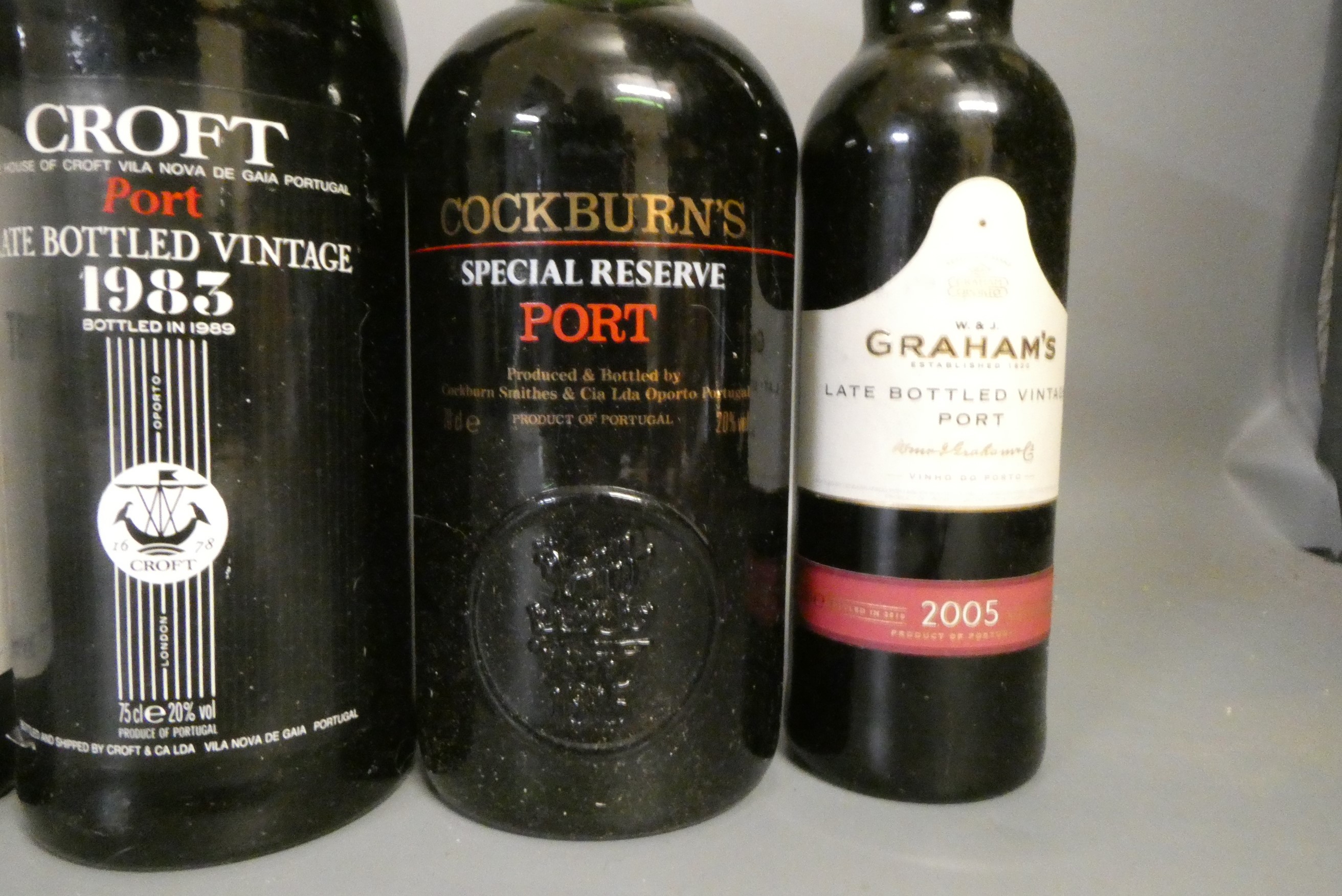Nine bottles of port and other alcohol Image