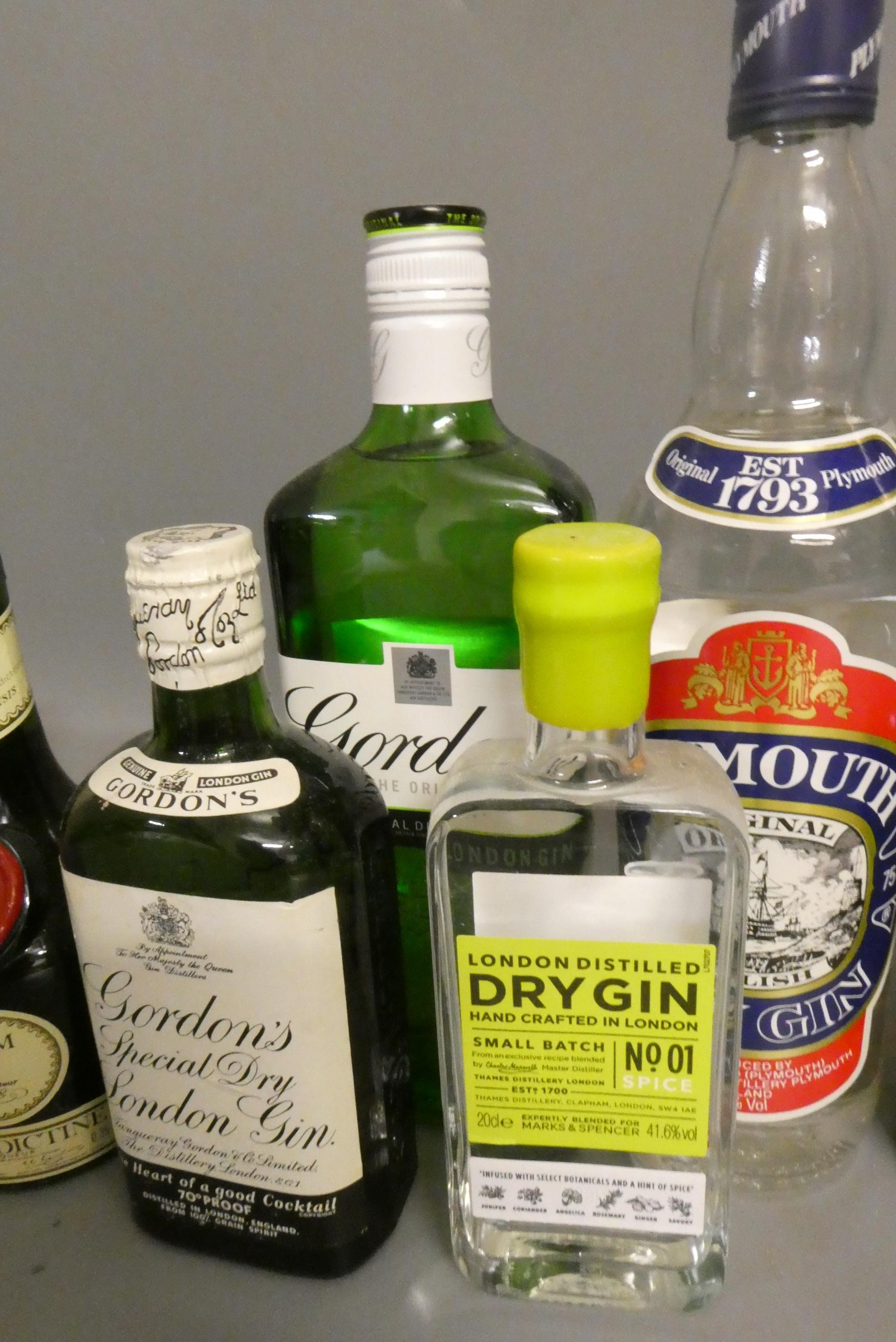 Twelve bottles of mixed liqueur and spirits Image