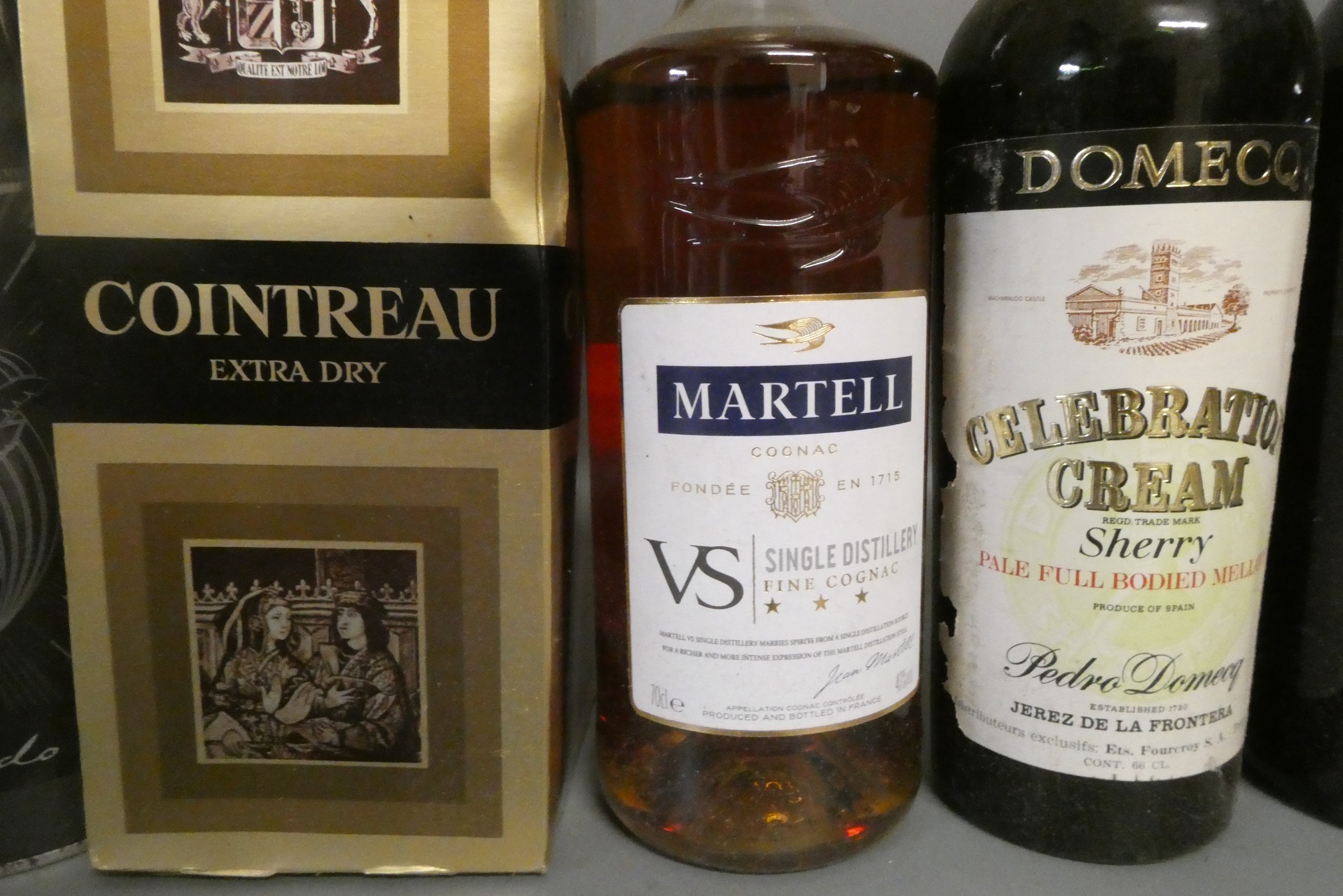 Eight bottles of mixed liqueurs and spirits Image