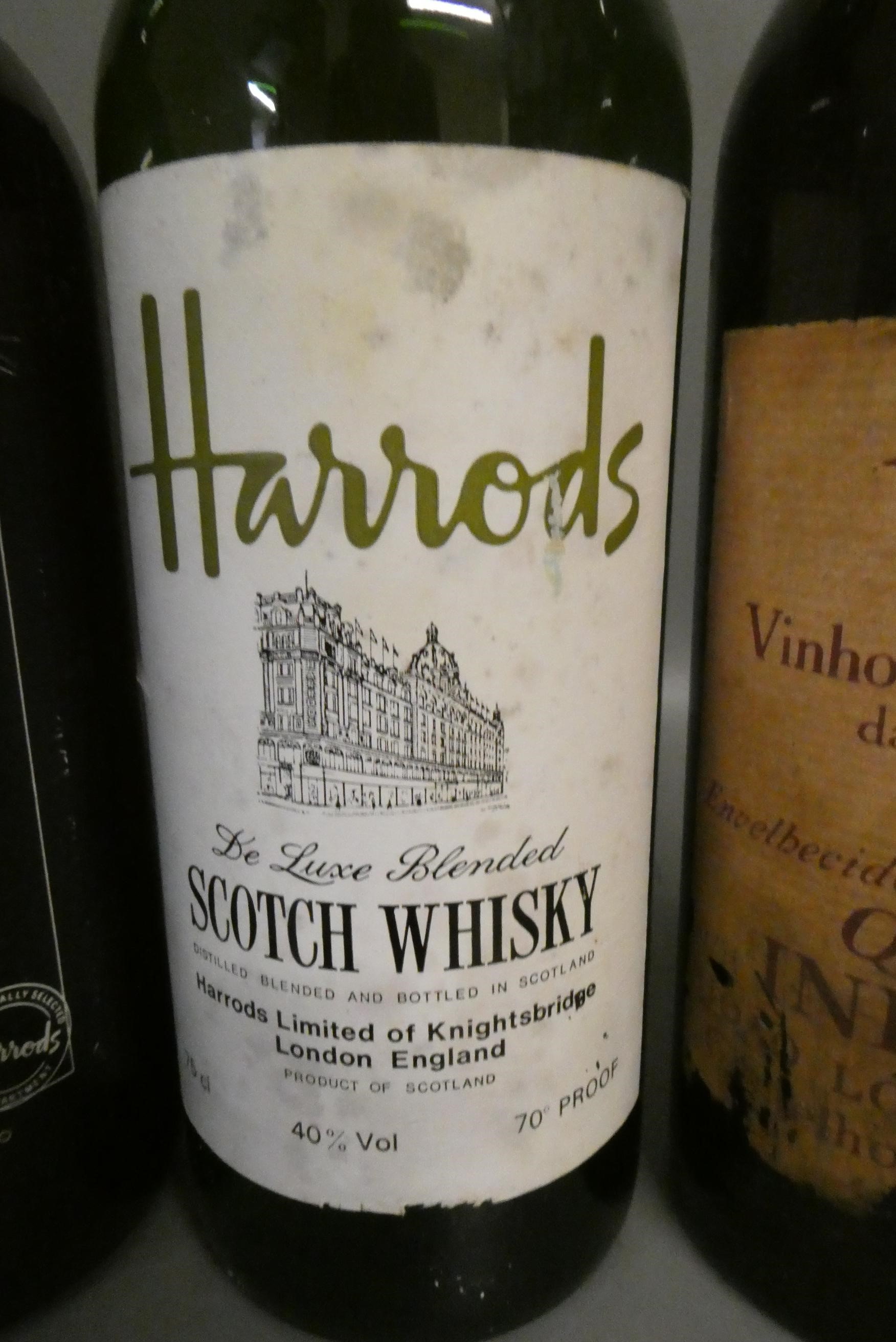 One bottle of Harrods de luxe blended scotch whisky, together with a Harrods old tawny port and a Image