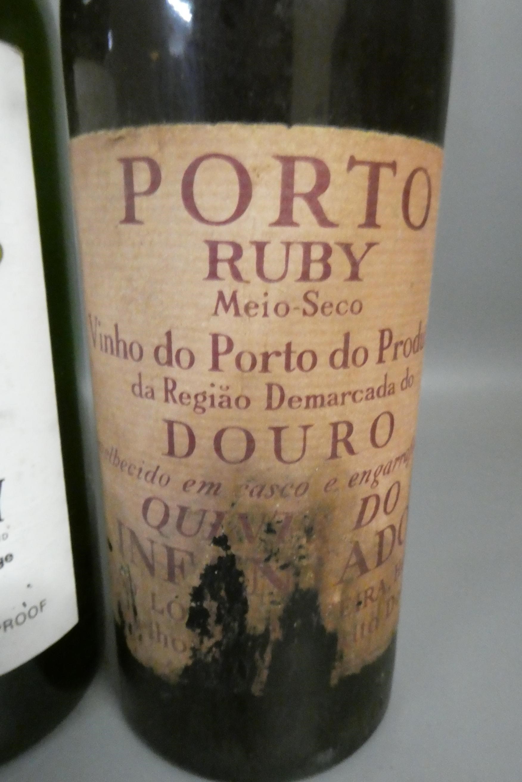 One bottle of Harrods de luxe blended scotch whisky, together with a Harrods old tawny port and a Image