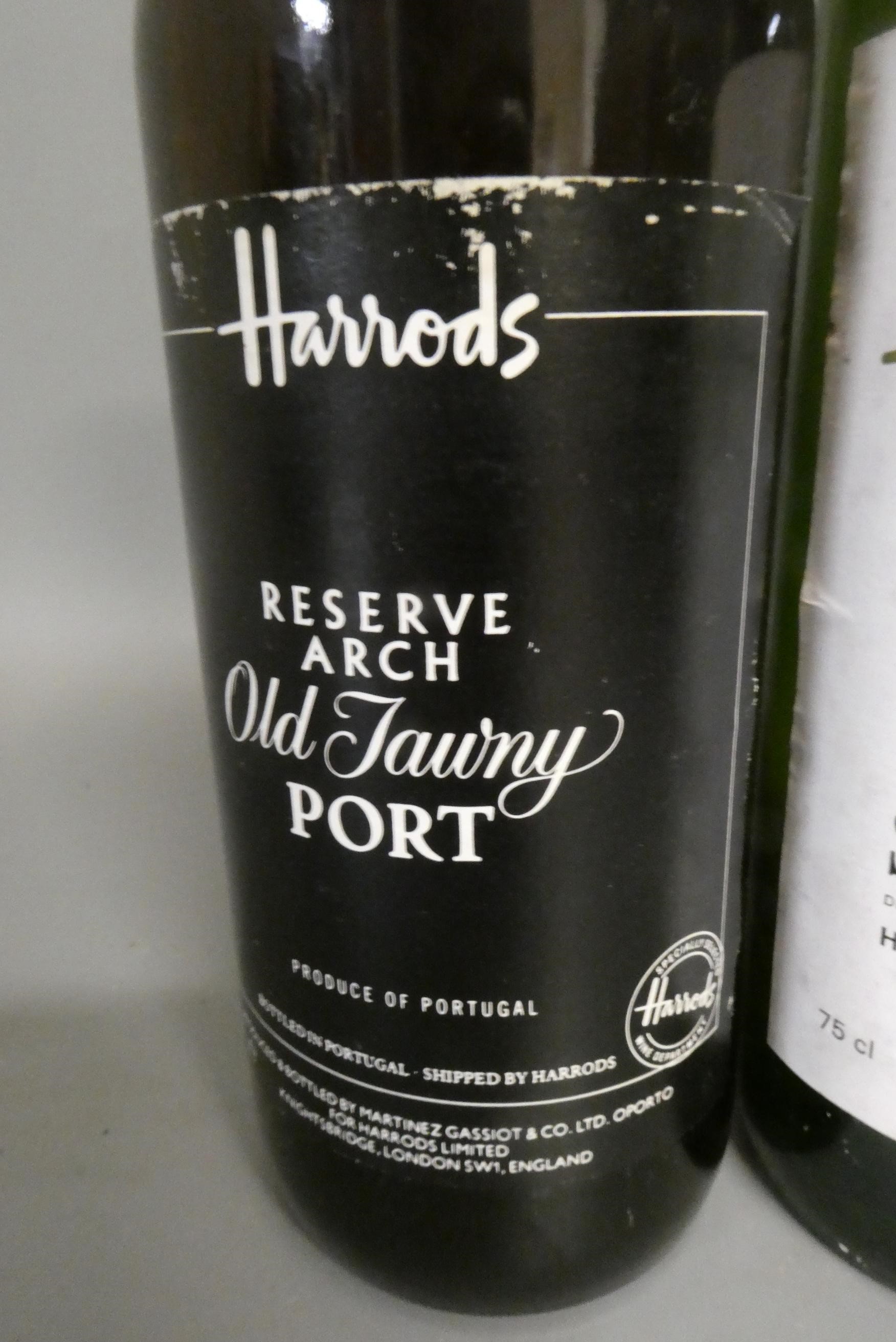 One bottle of Harrods de luxe blended scotch whisky, together with a Harrods old tawny port and a Image
