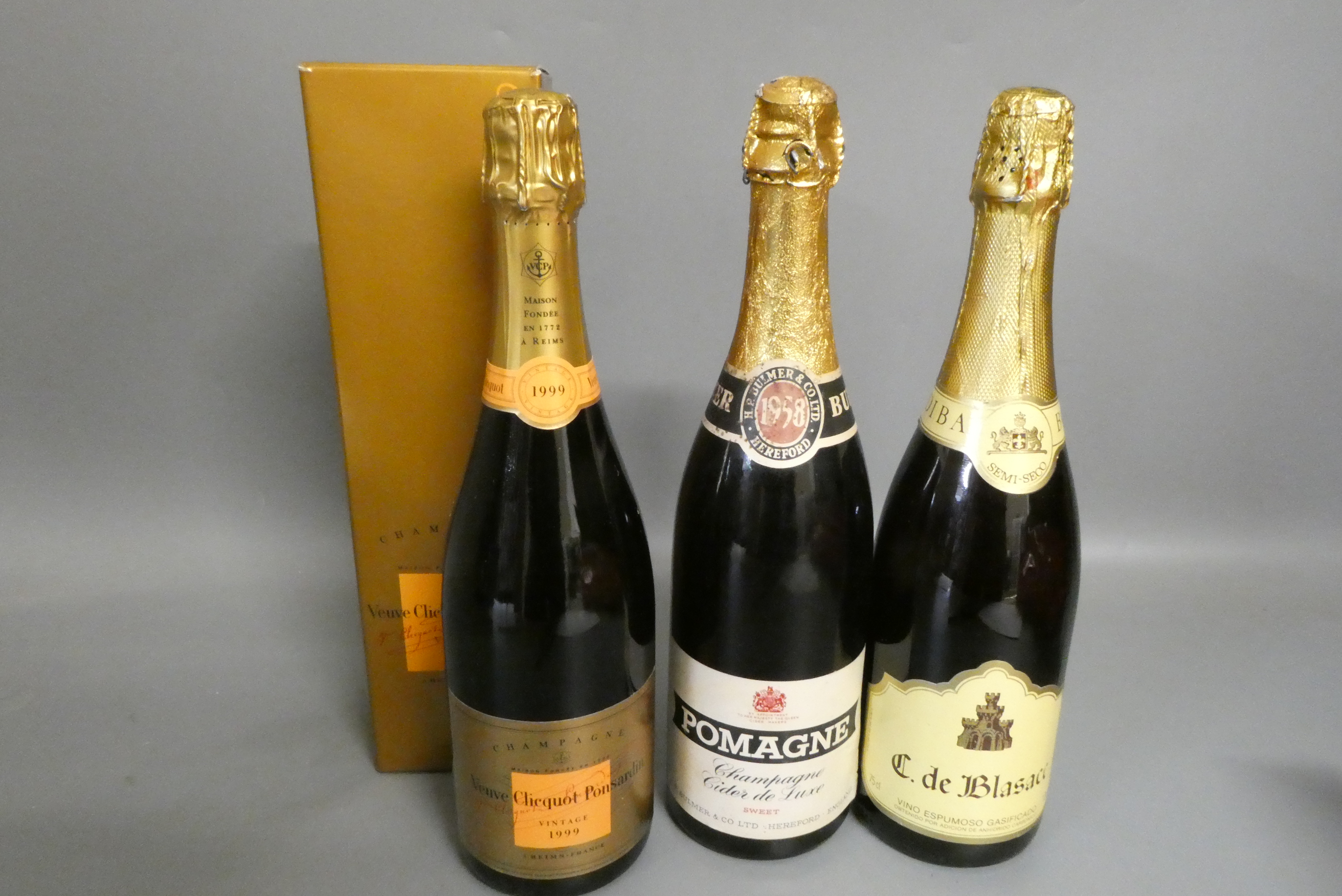 Three bottles of champagne, comprising a boxed Veuve Clicquot Ponsardin 1999 vintage, a 1958 Pomagne Image
