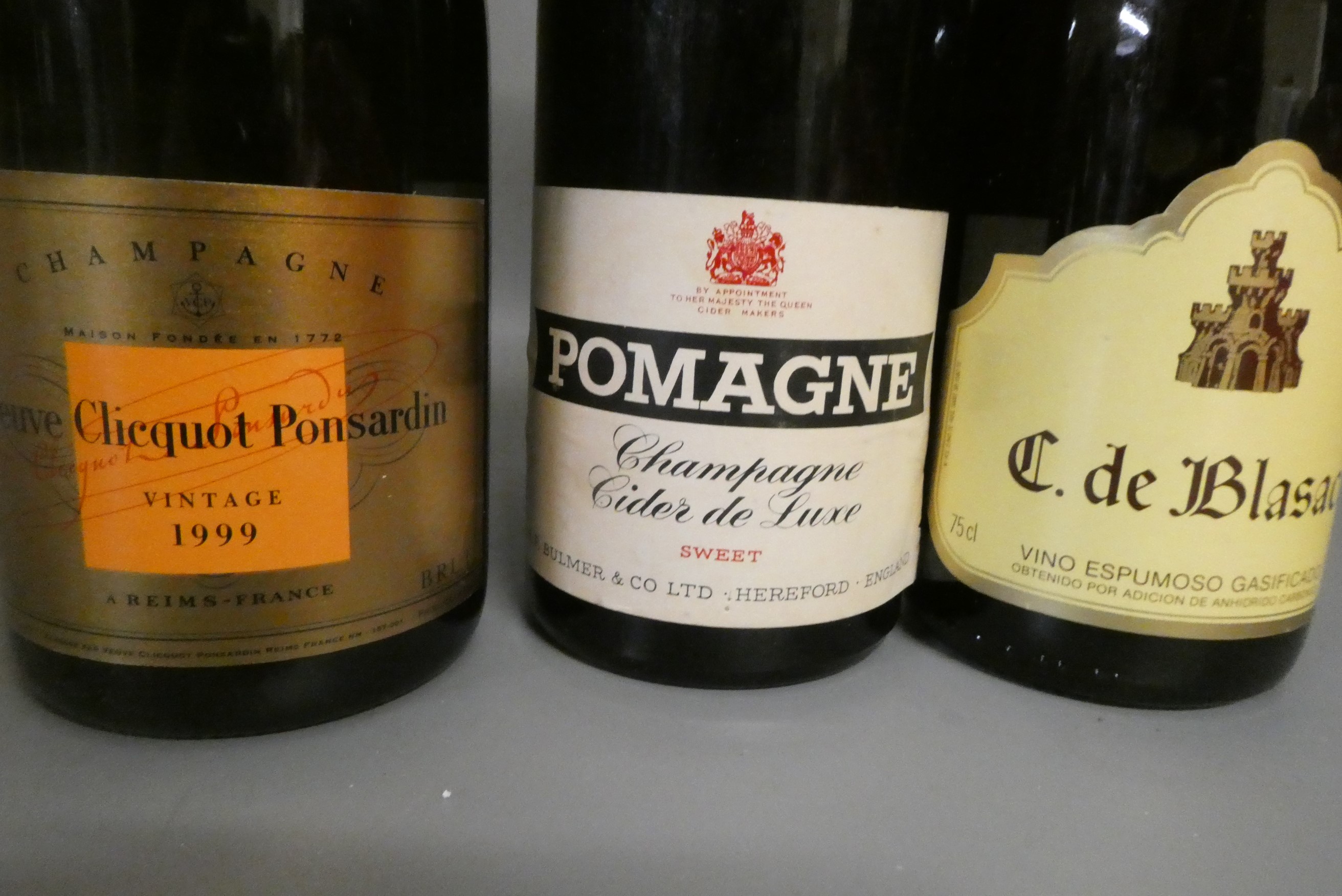 Three bottles of champagne, comprising a boxed Veuve Clicquot Ponsardin 1999 vintage, a 1958 Pomagne Image
