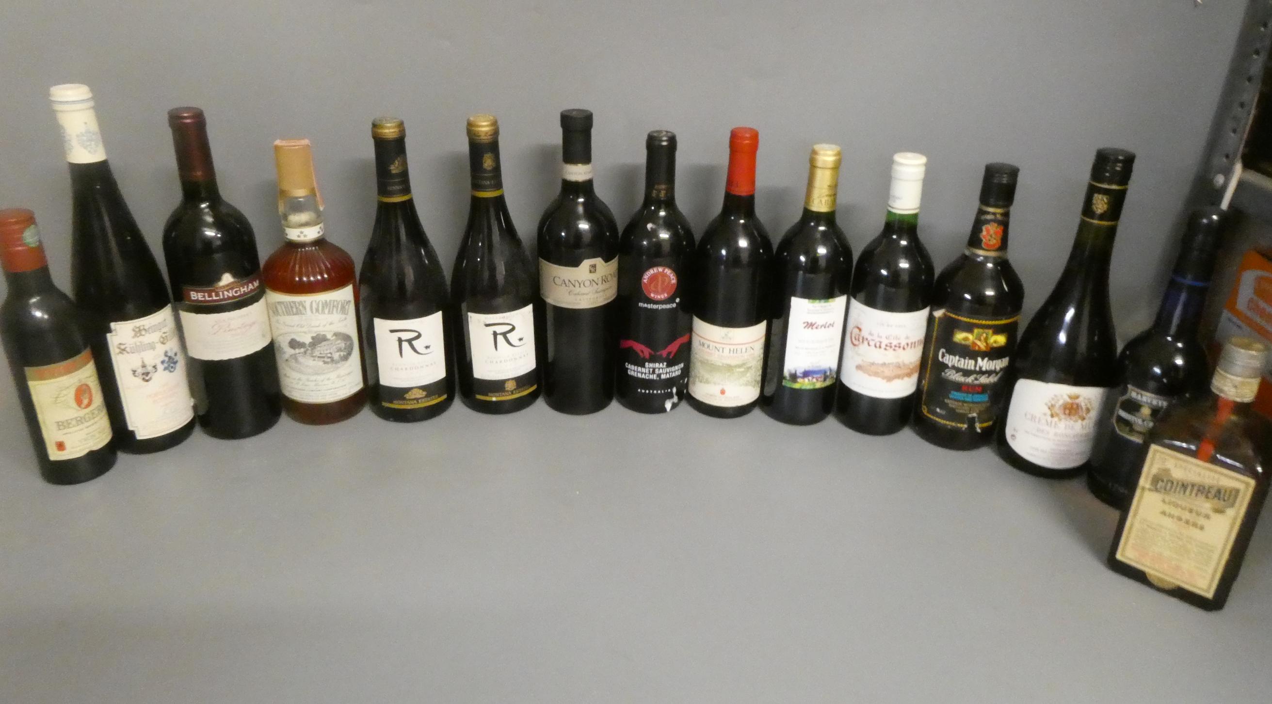 Fourteen and one half bottles of mixed wine and liqueur Image