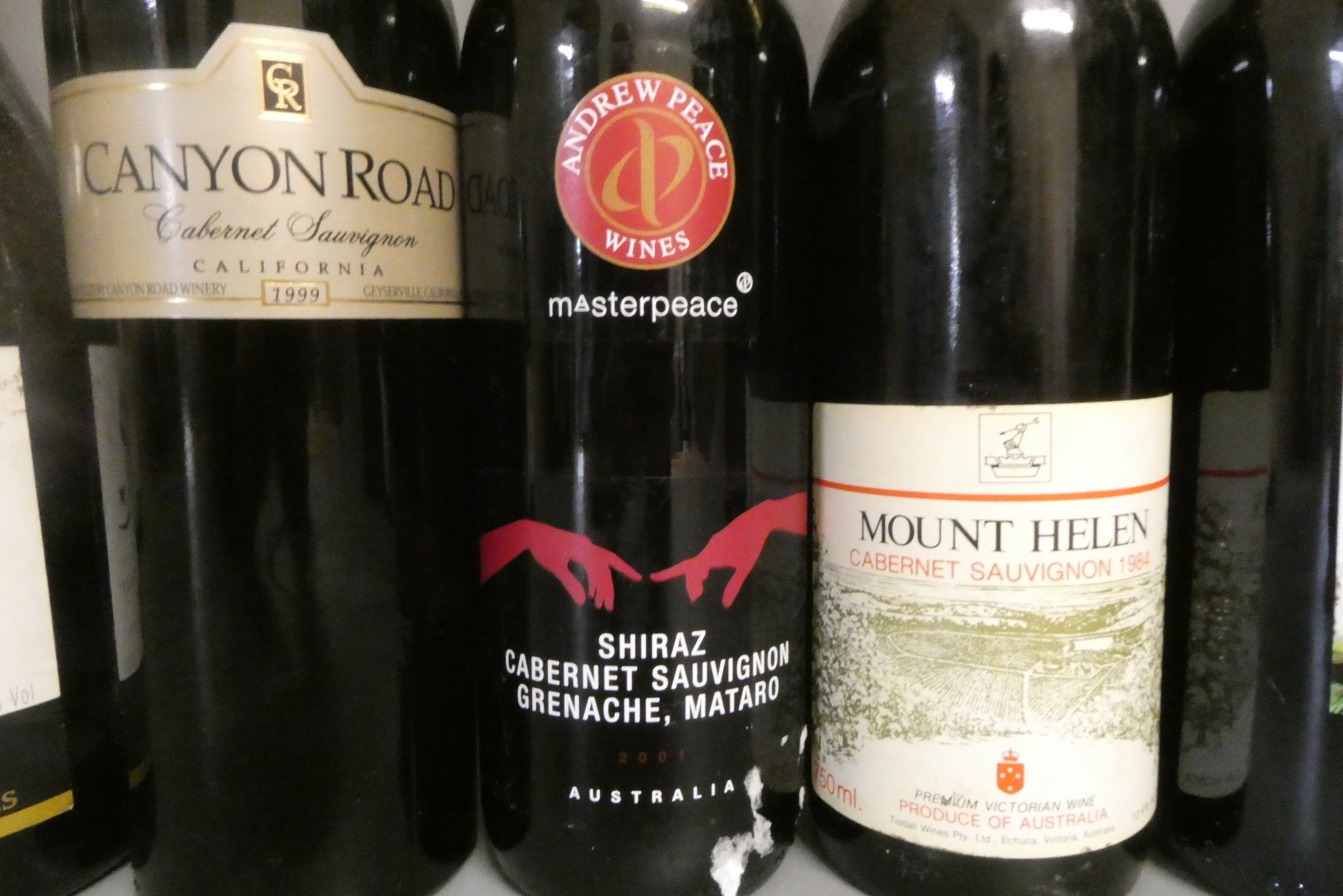 Fourteen and one half bottles of mixed wine and liqueur Image