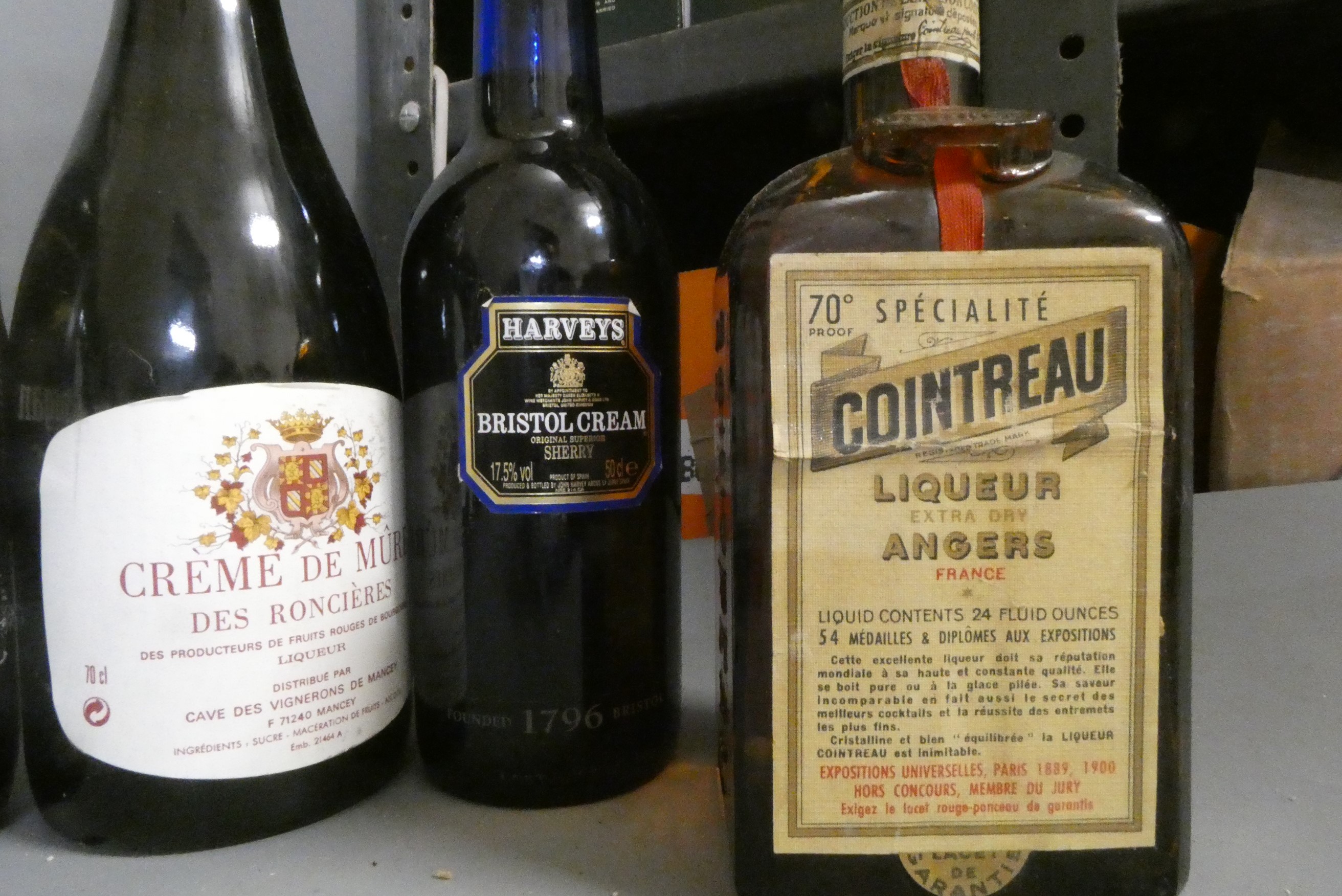 Fourteen and one half bottles of mixed wine and liqueur Image