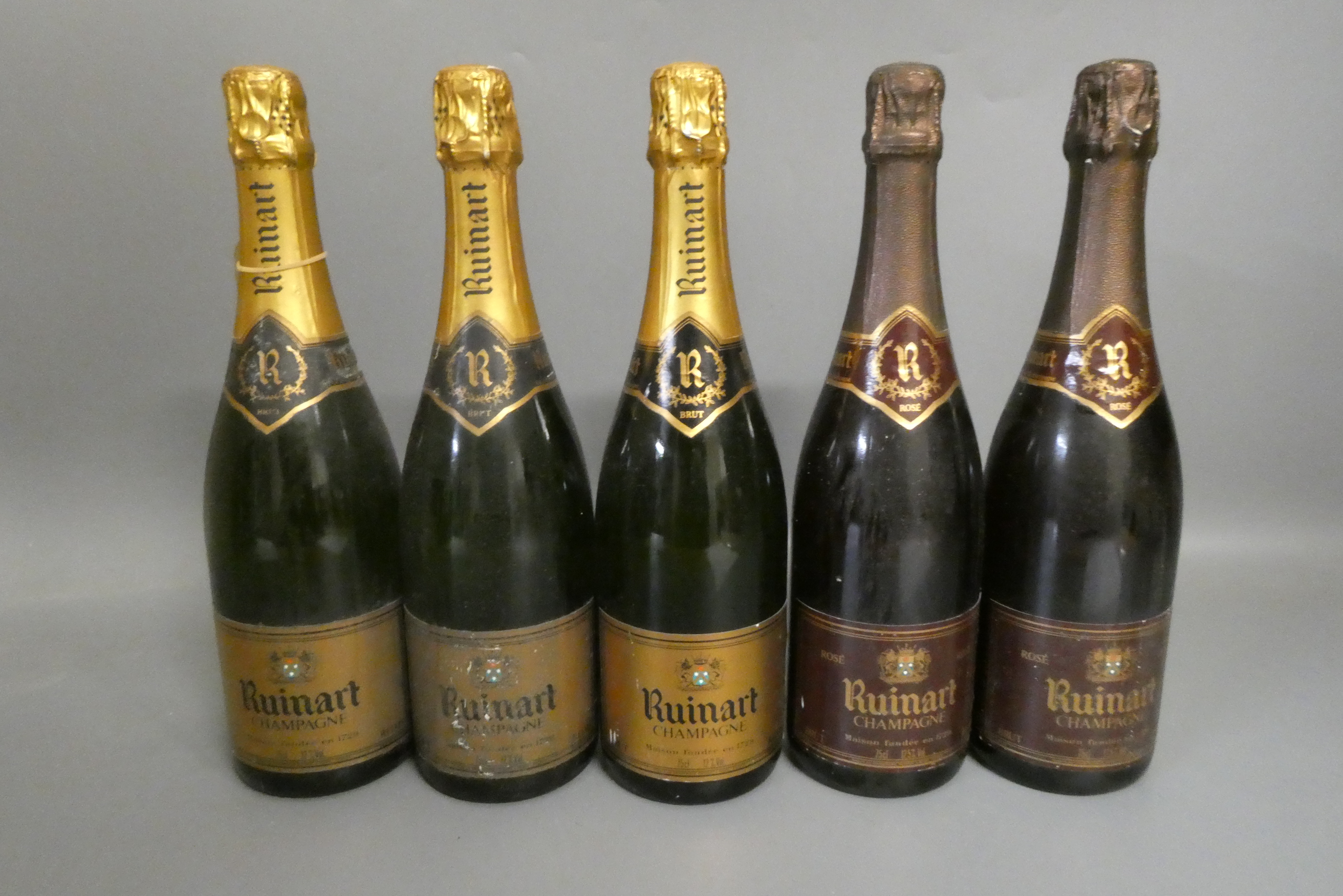 Five bottles Ruinart champagne, comprising three champagne brut and two champagne rose (Est. plus Image