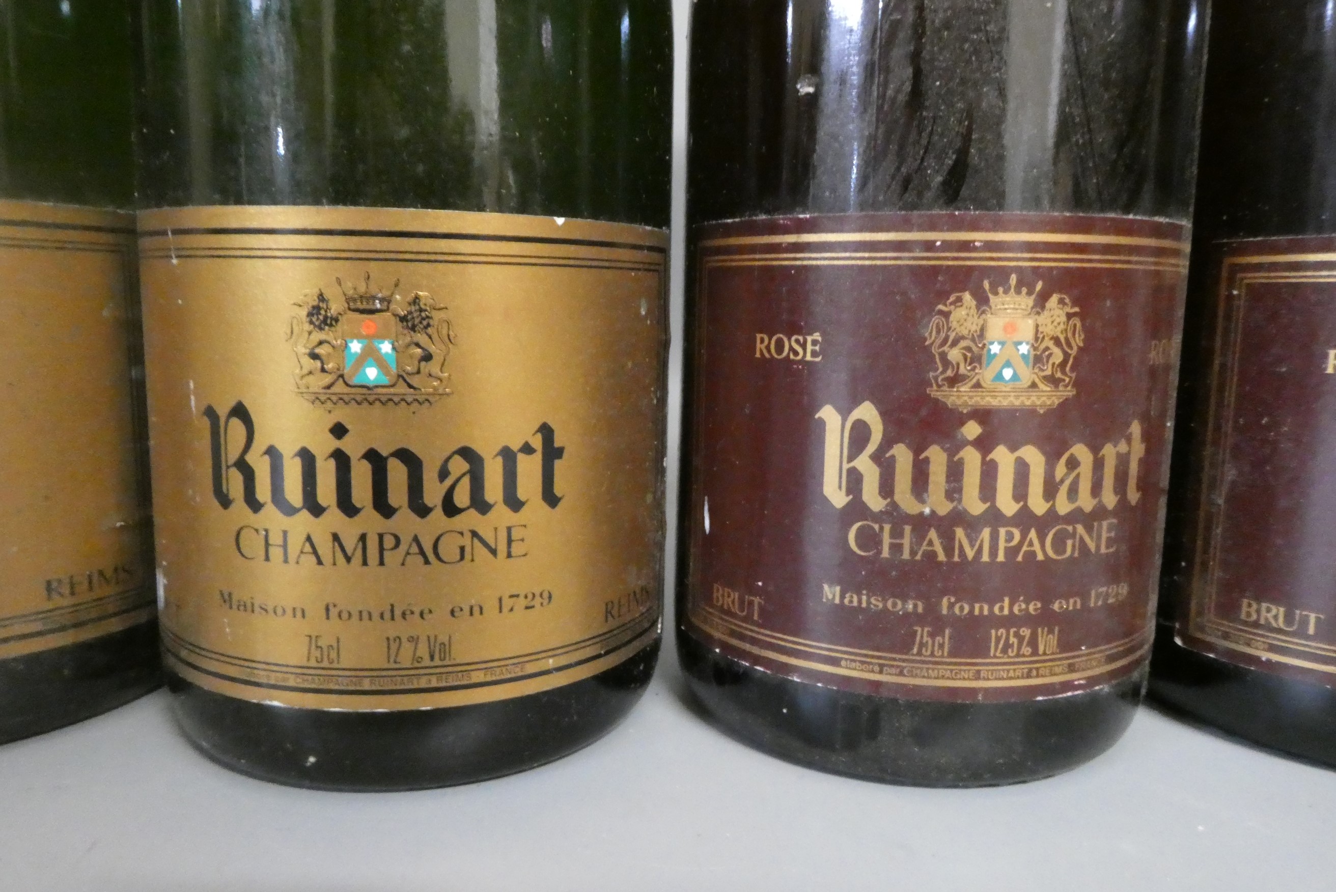 Five bottles Ruinart champagne, comprising three champagne brut and two champagne rose (Est. plus Image