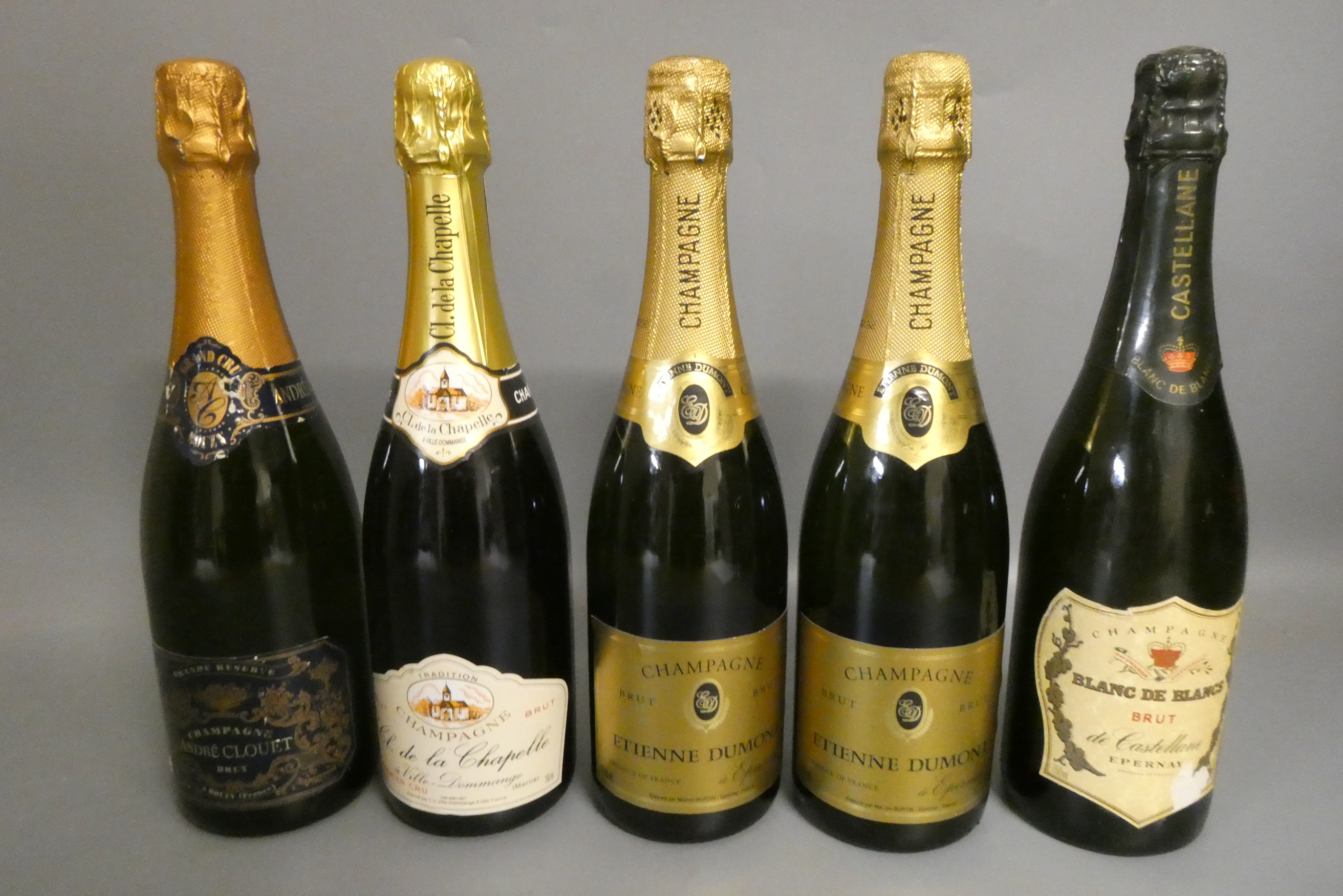 Five bottles of champagne, comprising two Etienne Dumont brut, one Andre Clouet brut, one Cl. de la Image