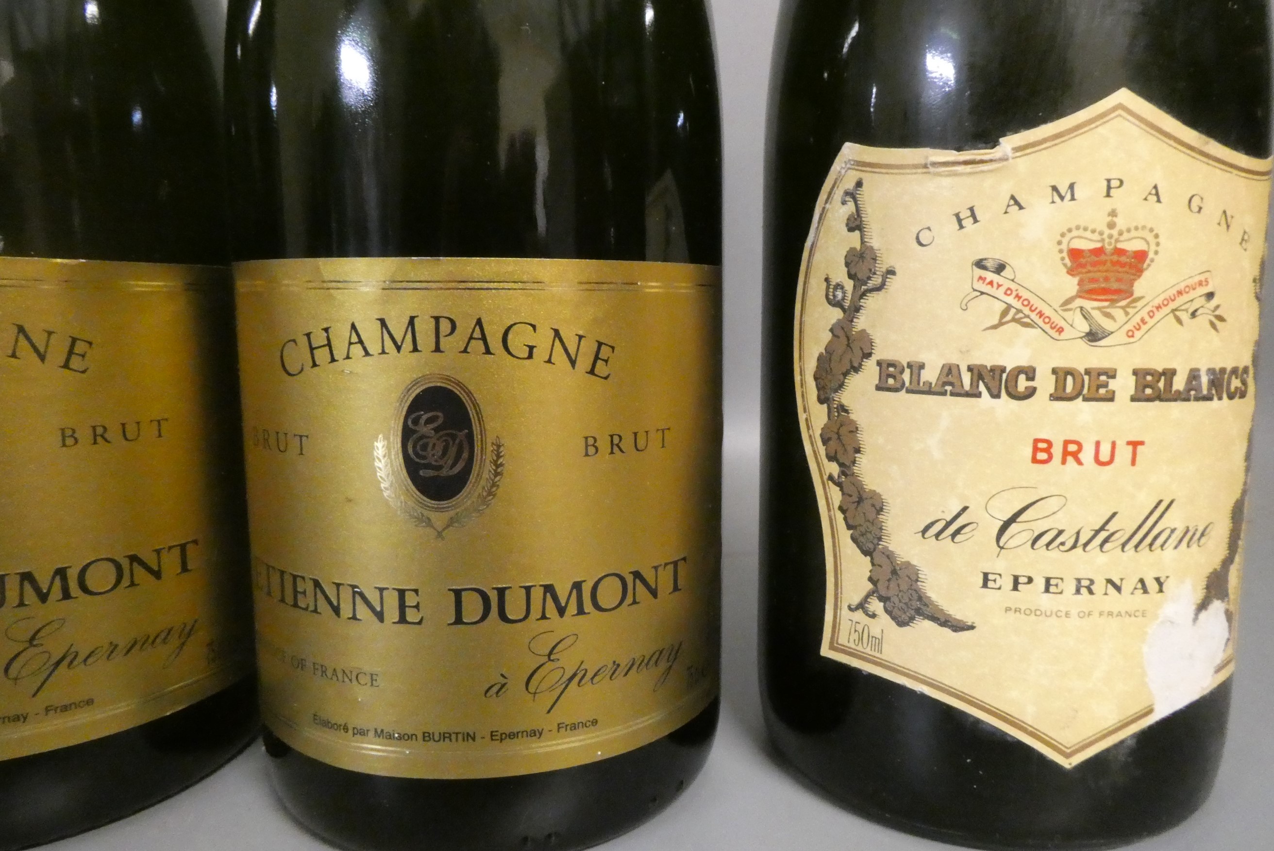 Five bottles of champagne, comprising two Etienne Dumont brut, one Andre Clouet brut, one Cl. de la Image