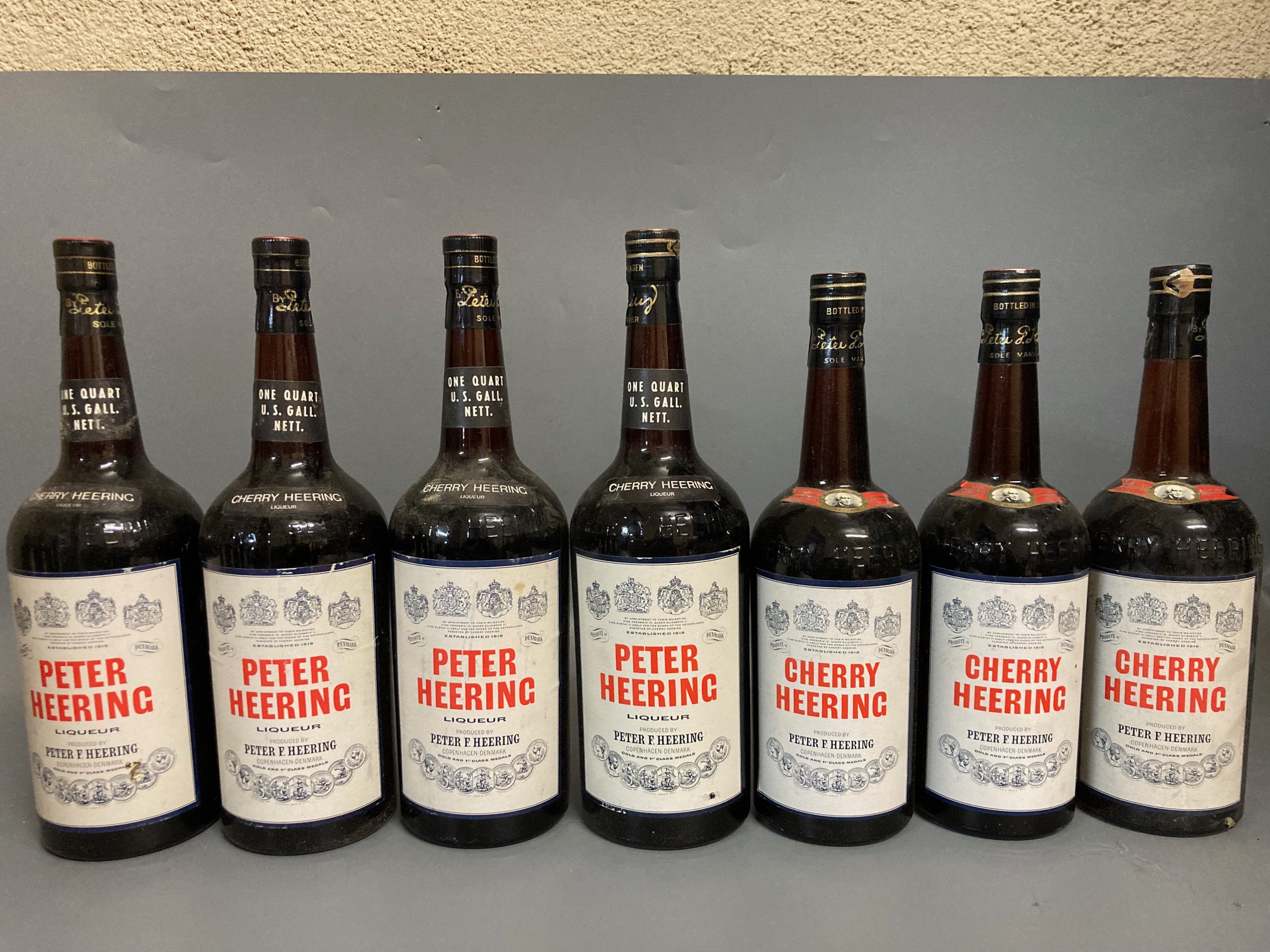 Seven bottles Peter Heering Liqueur, comprising 4 litre bottles and 3 70cl bottles (Est. plus 24% Image