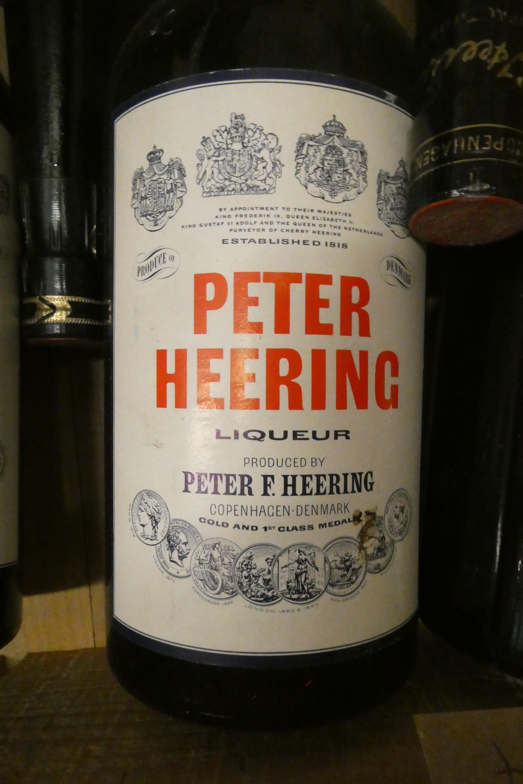 Seven bottles Peter Heering Liqueur, comprising 4 litre bottles and 3 70cl bottles (Est. plus 24% Image