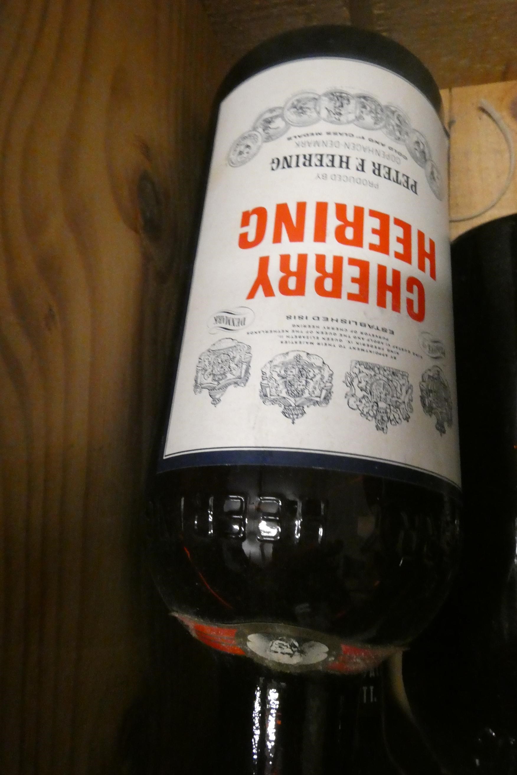 Seven bottles Peter Heering Liqueur, comprising 4 litre bottles and 3 70cl bottles (Est. plus 24% Image