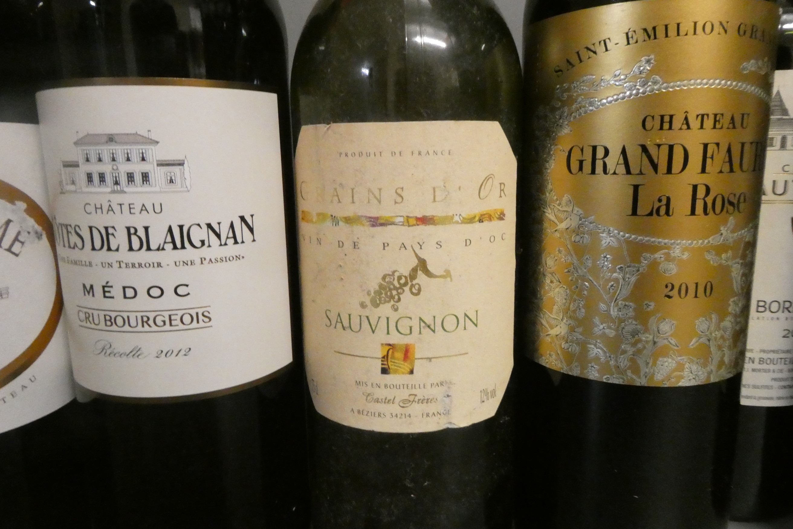 Twelve bottles of mainly French bordeaux including Ch. Grand Faurie La Rose 2010 Saint-Emilion grand Image
