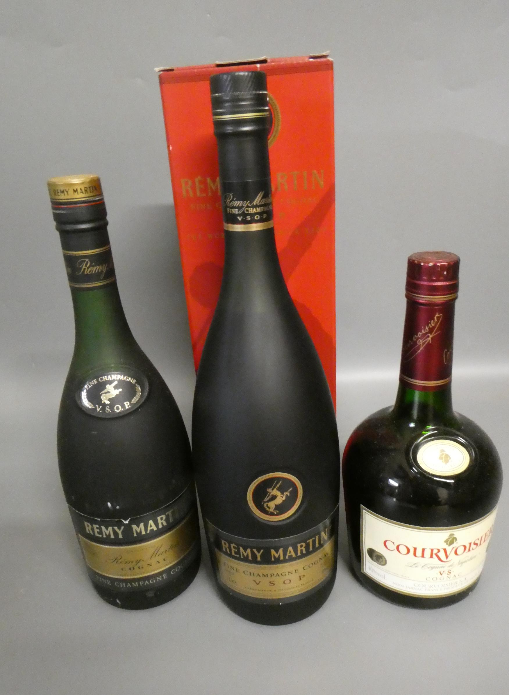 Three bottles of cognac, comprising 1litre boxed Remy Martin VSOP fine champagne cognac, a 68cl Remy Image