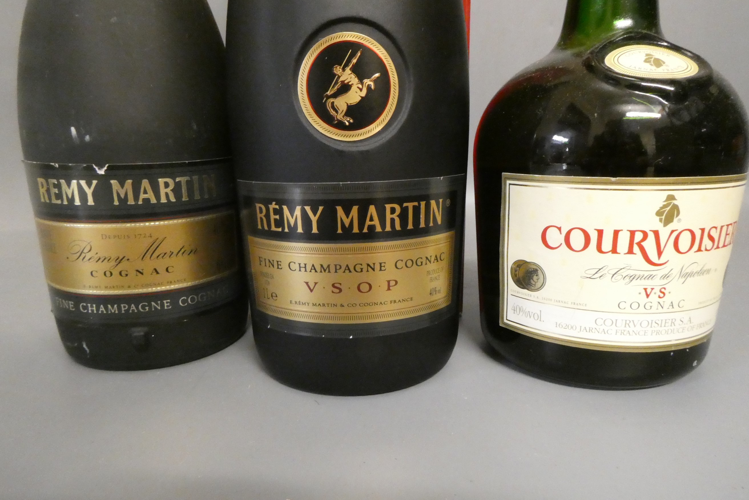Three bottles of cognac, comprising 1litre boxed Remy Martin VSOP fine champagne cognac, a 68cl Remy Image