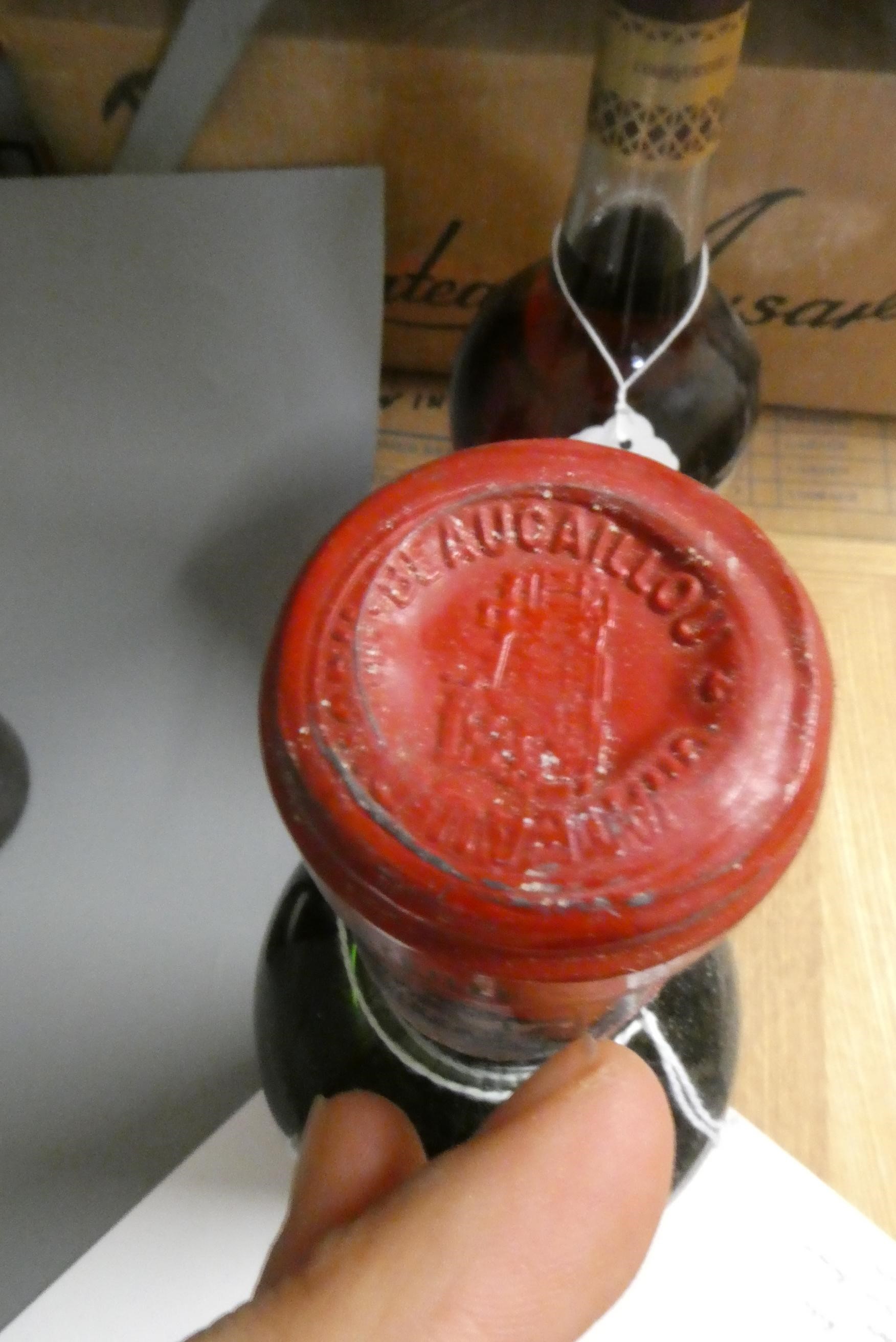 Three bottles of red Bordeaux, comprising a Mouton Rothschild pauillac presumed 1979, a Ducru Image