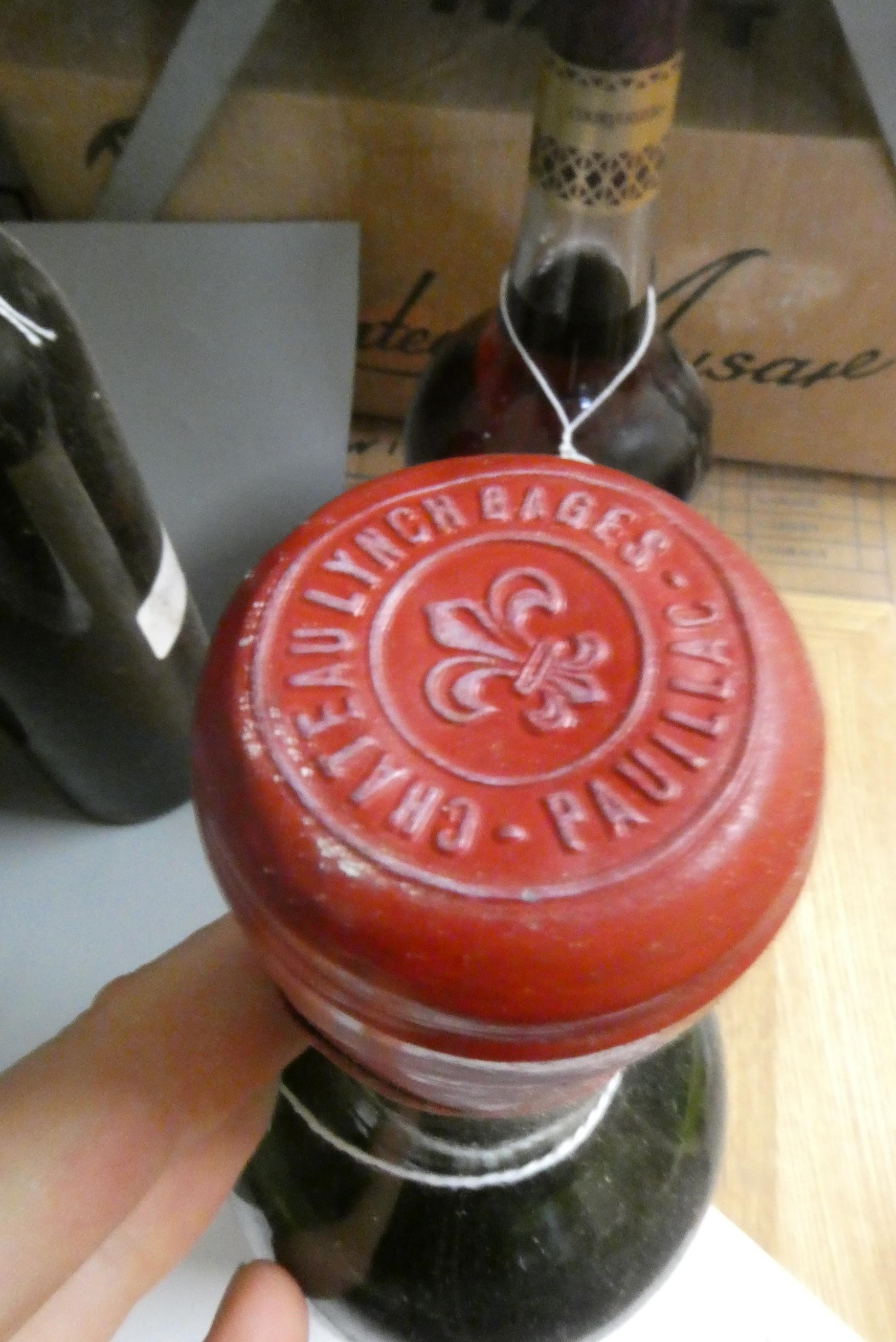 Three bottles of red Bordeaux, comprising a Mouton Rothschild pauillac presumed 1979, a Ducru Image