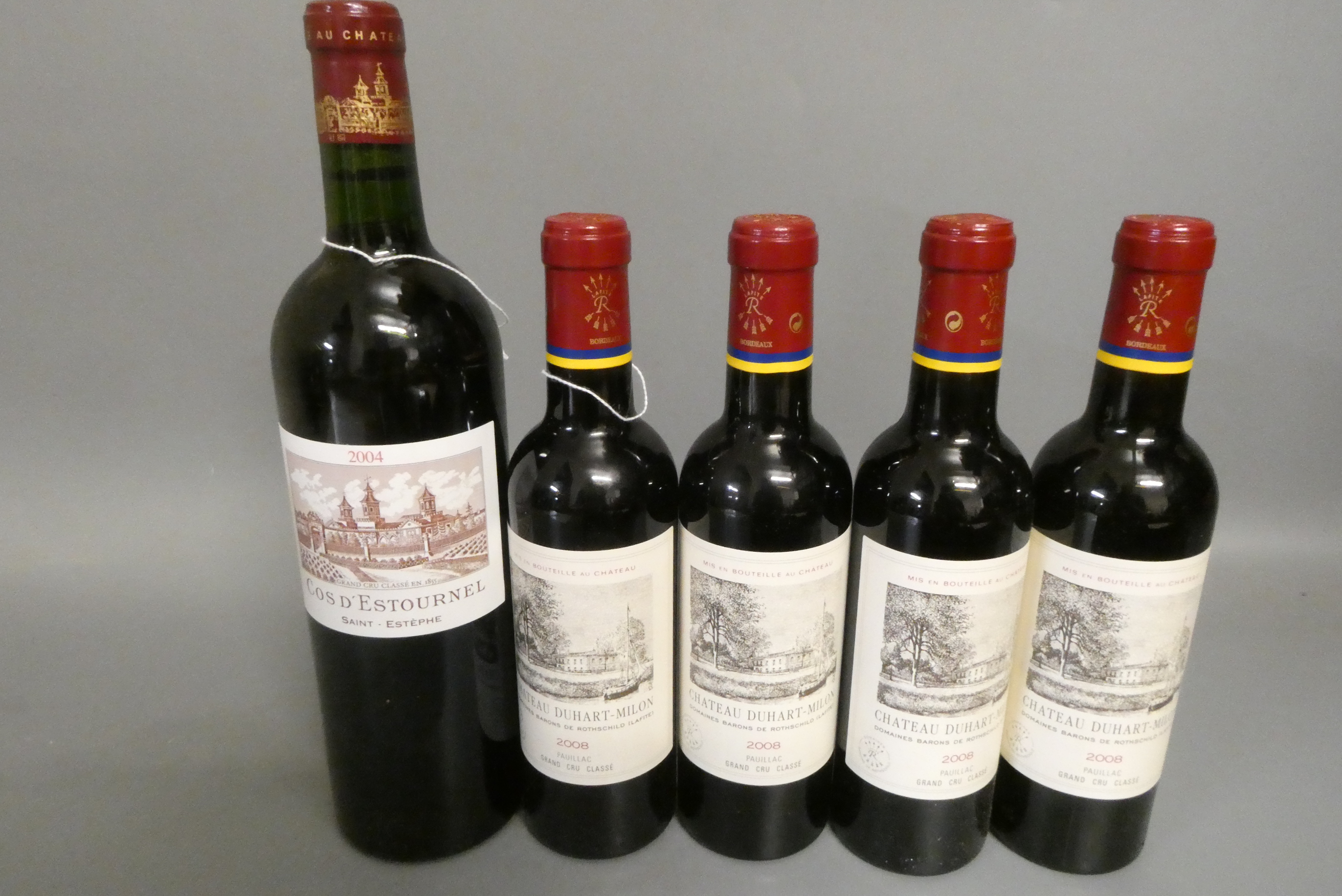 One bottle and four half bottles of Bordeaux Image