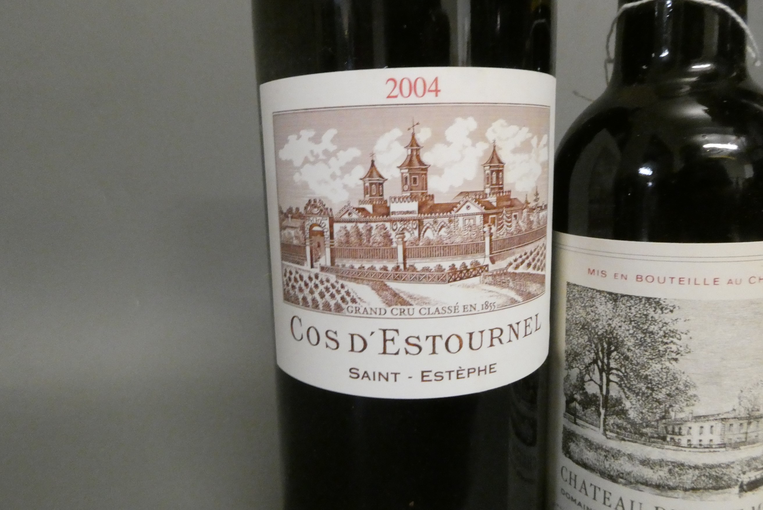 One bottle and four half bottles of Bordeaux Image
