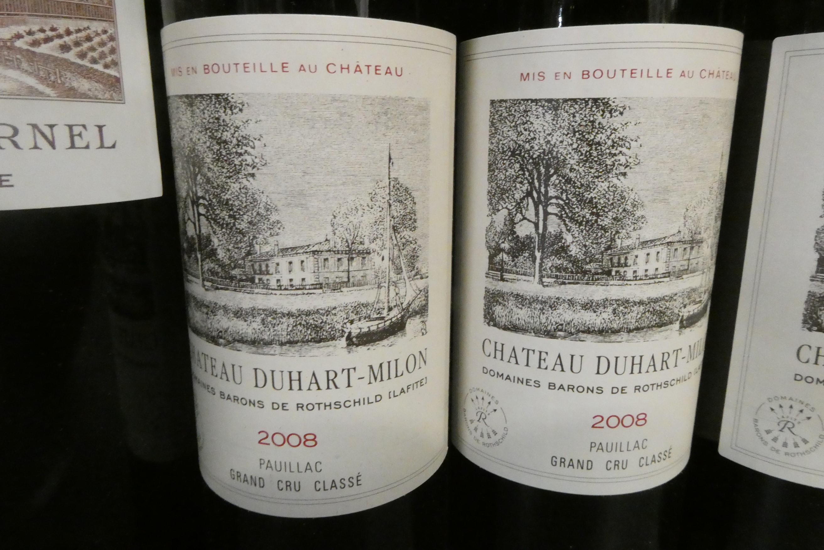 One bottle and four half bottles of Bordeaux Image