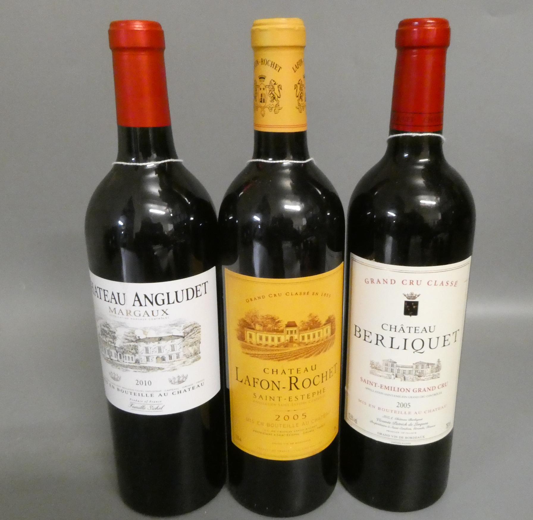 Three bottles of red bordeaux Image