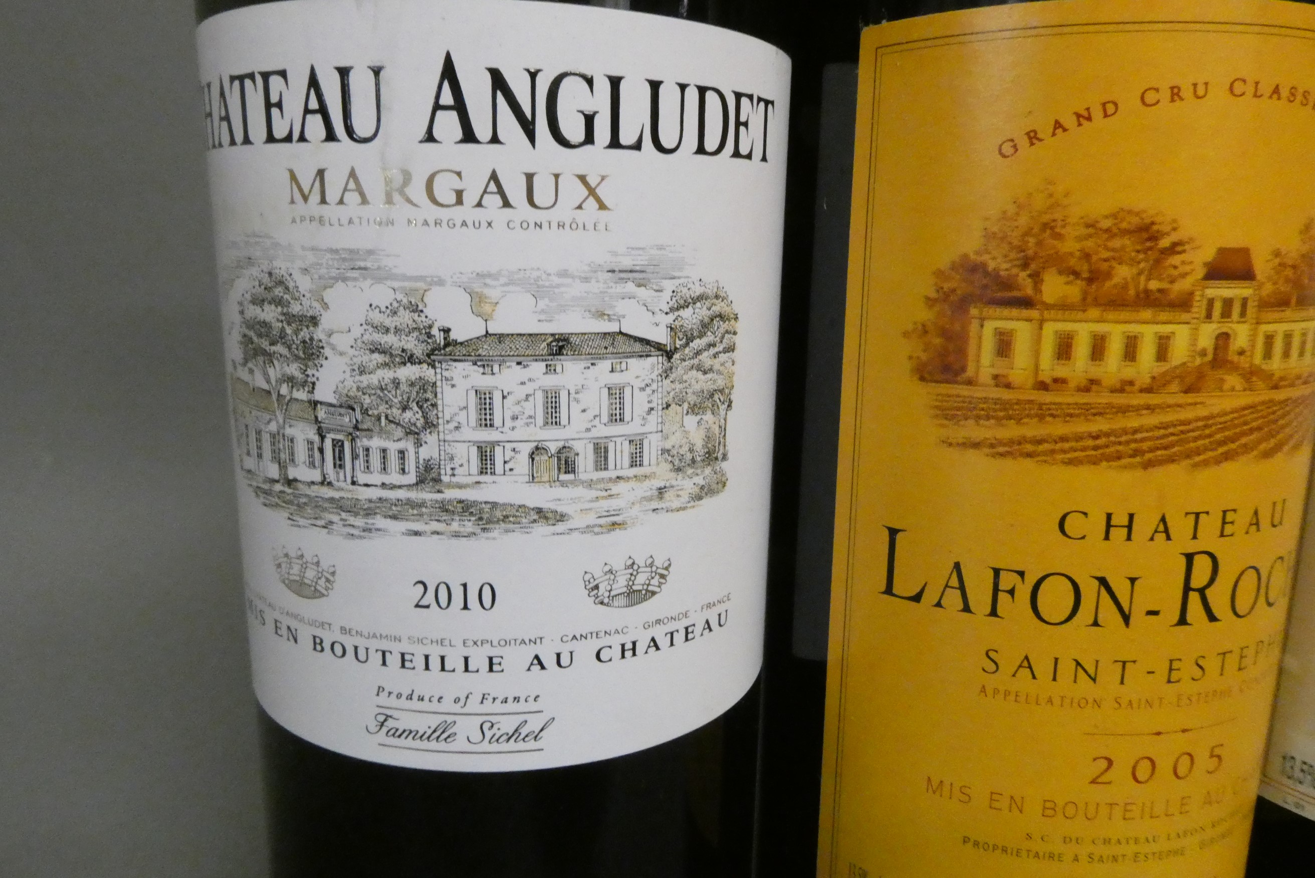 Three bottles of red bordeaux Image