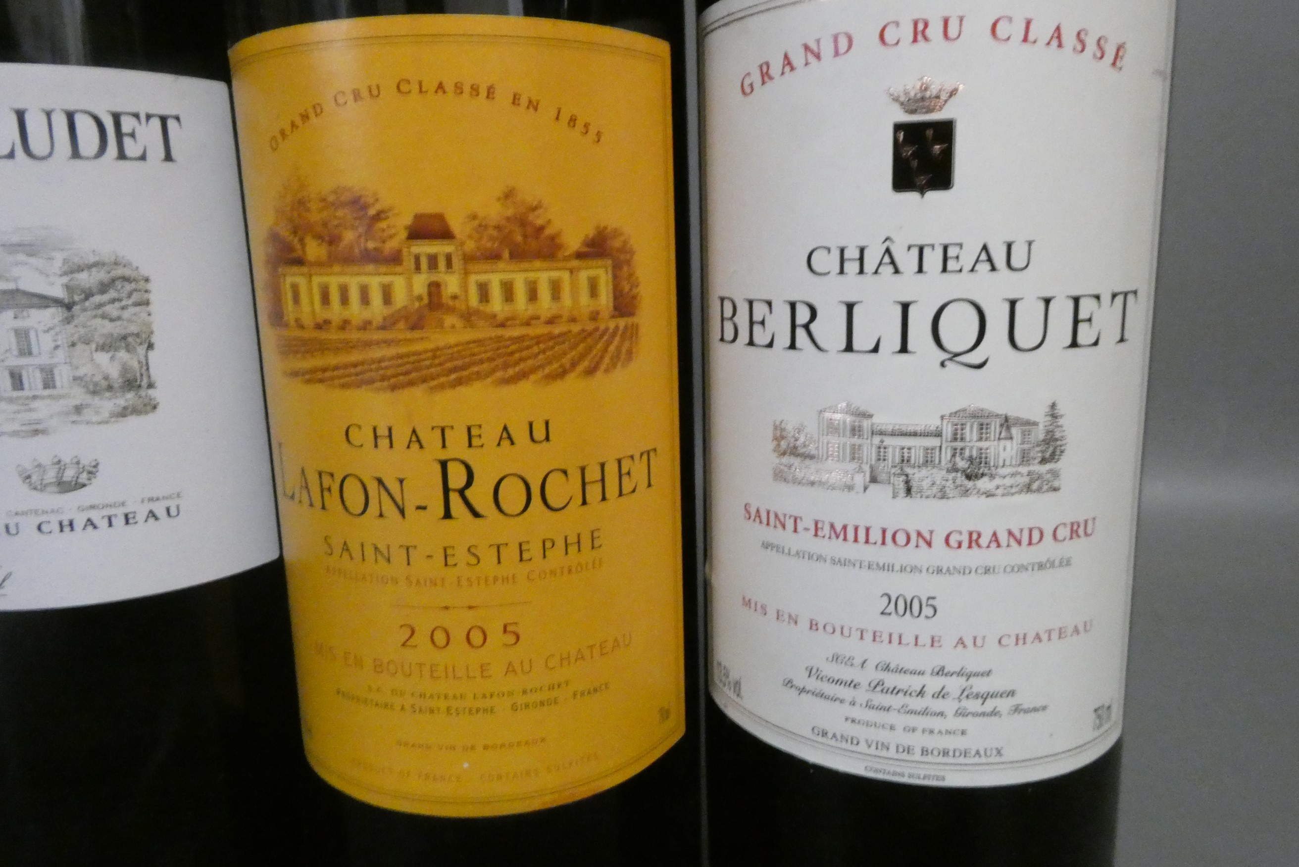 Three bottles of red bordeaux Image