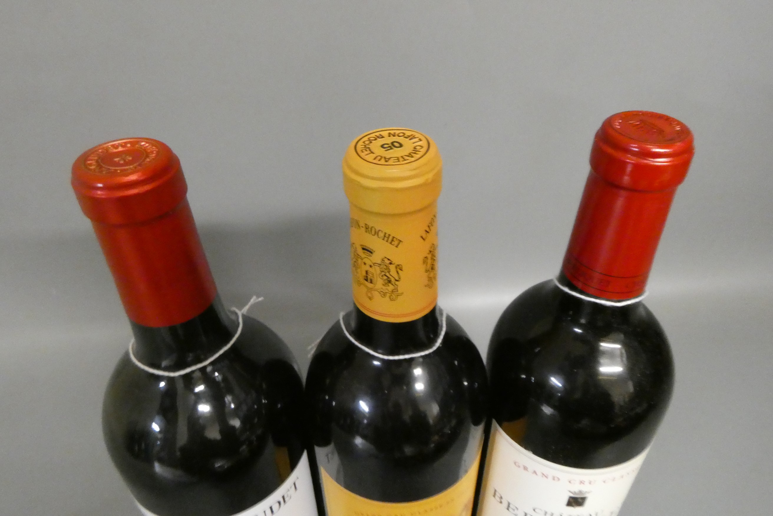 Three bottles of red bordeaux Image
