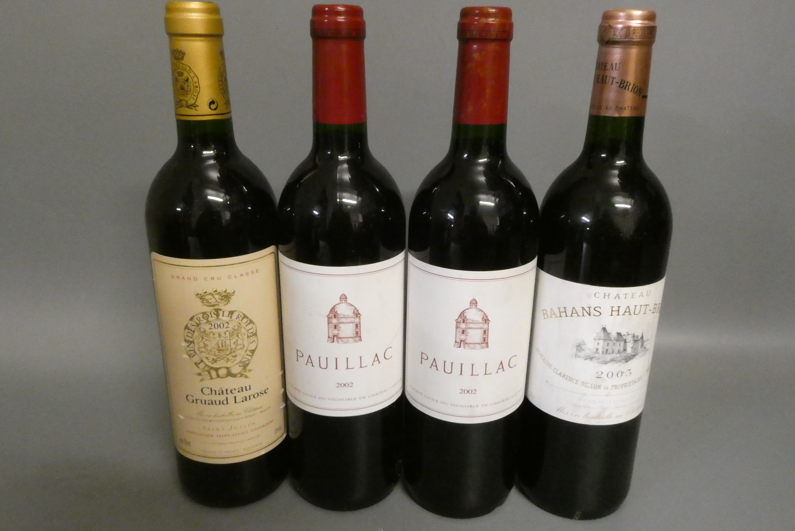 Four bottles of Bordeaux Image